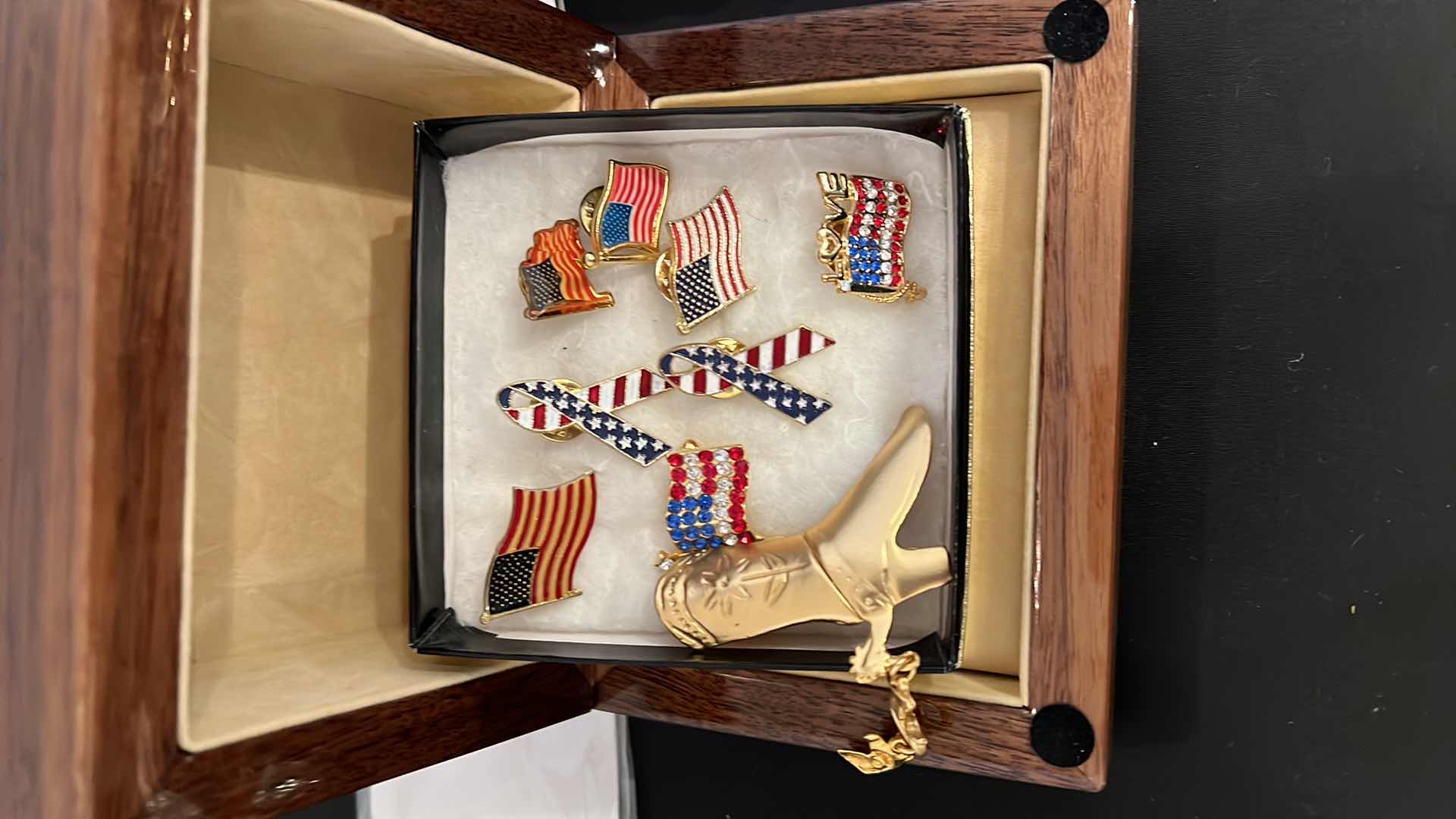 Photo 1 of AMERICAN FLAG PINS AND COWBOY BOOT BROACH.