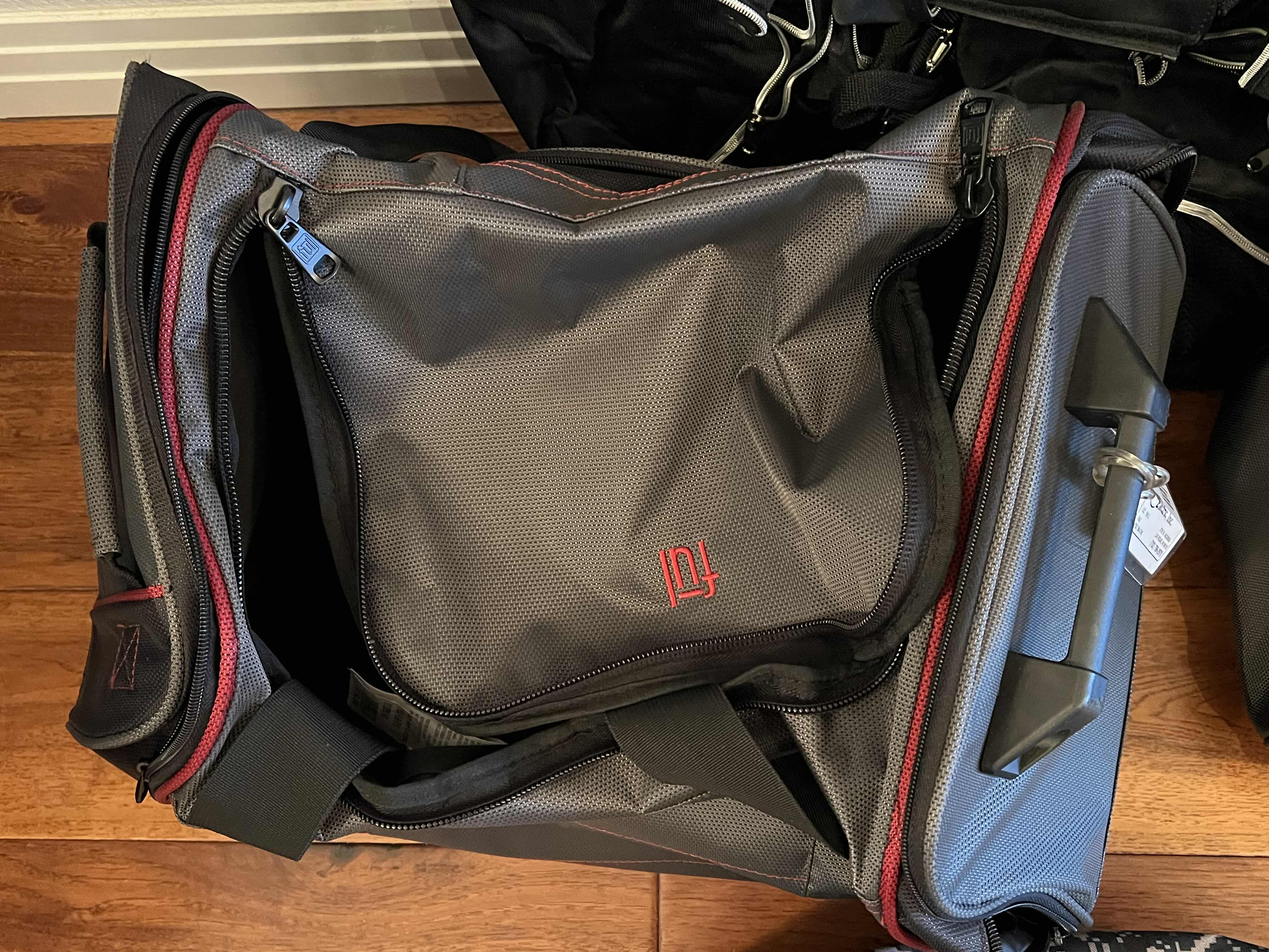 Photo 1 of 5-DUFFEL BAGS. VARIOUS STYLES ANS COLORS. ONE ROLLING BAG.