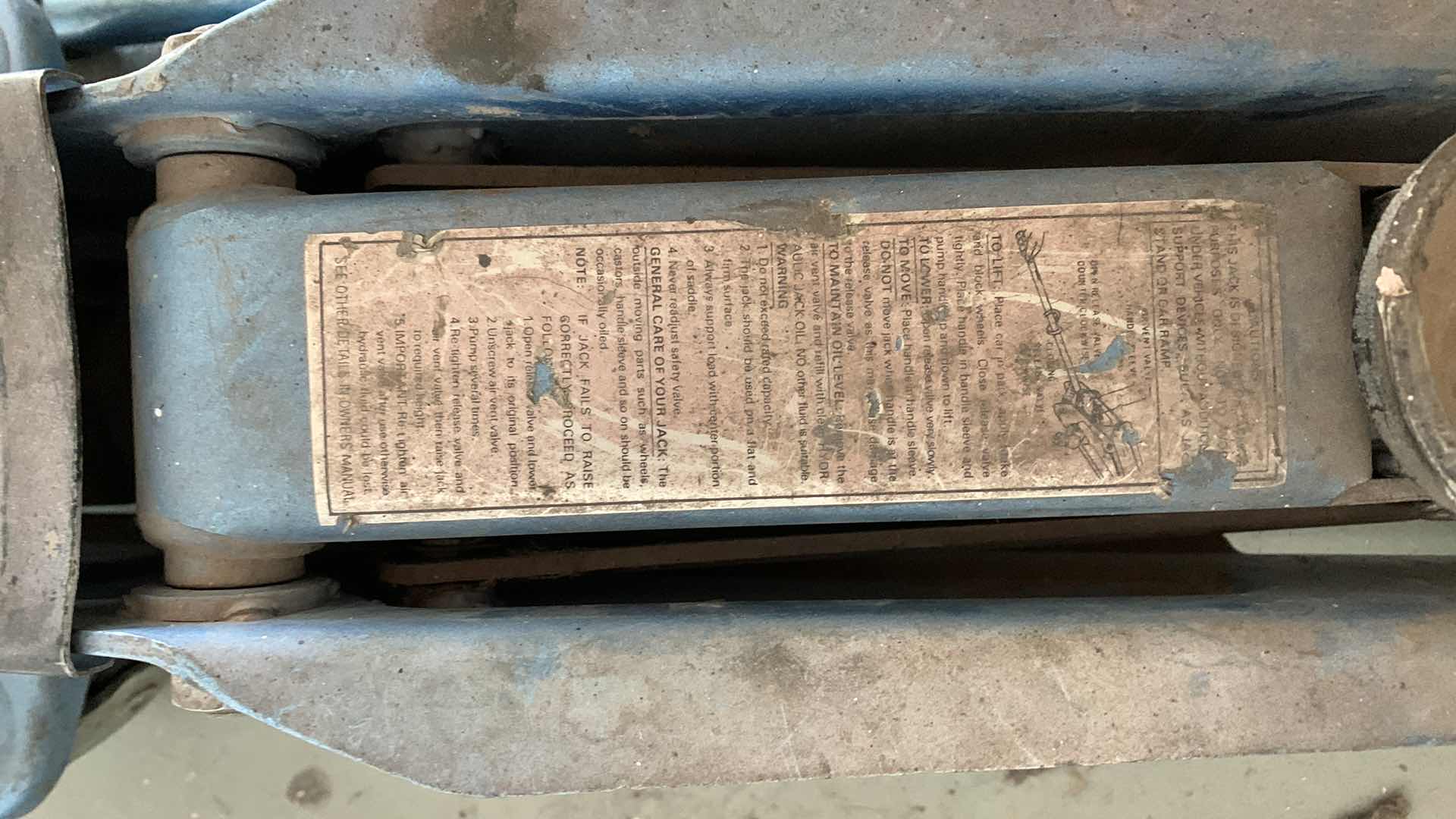 Photo 1 of AUTO PARTS-CAR LIFITNG  JACK FOR OIL CHANGES AND REPAIRS.