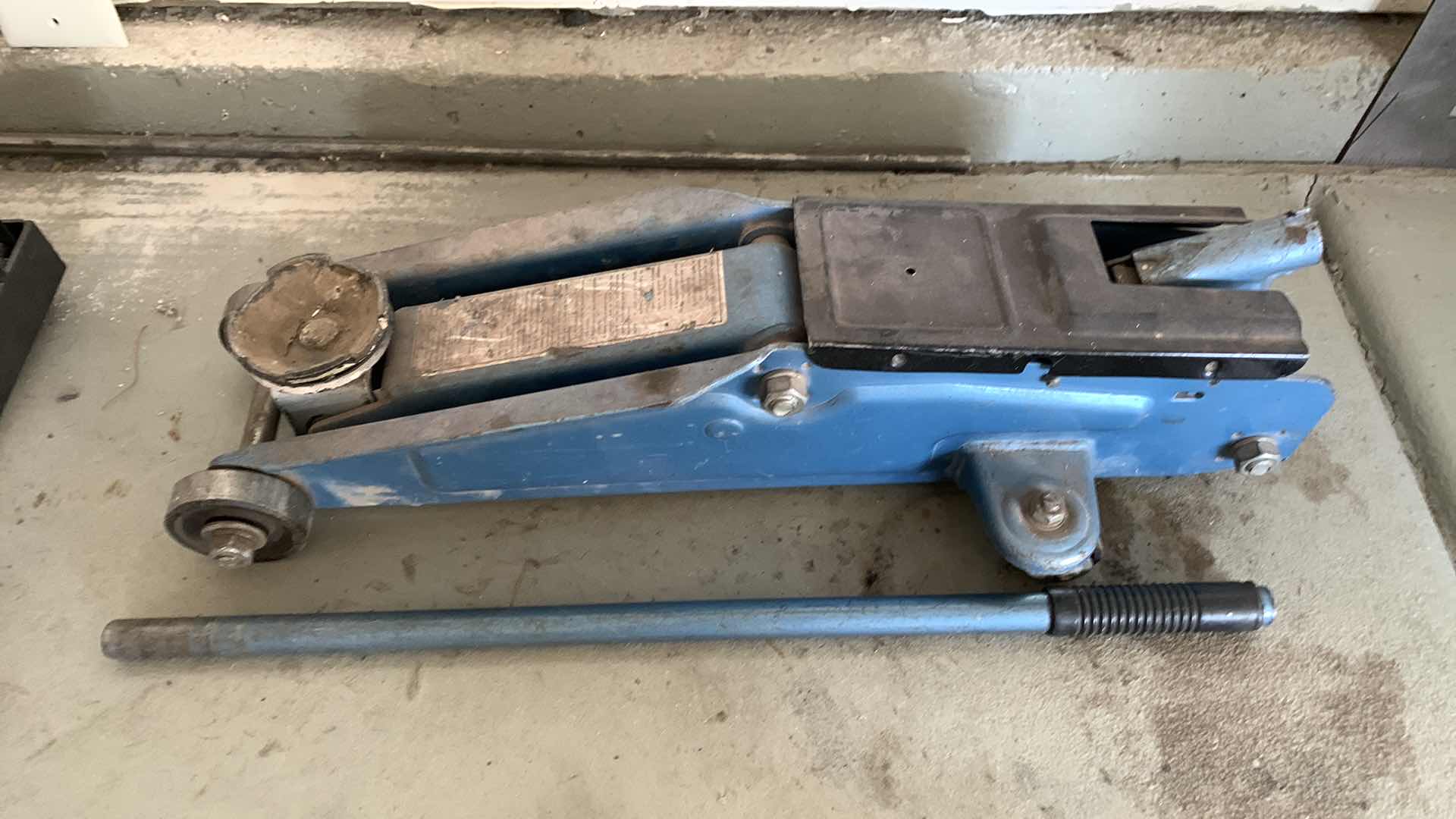 Photo 1 of AUTO PARTS-CAR LIFITNG  JACK FOR OIL CHANGES AND REPAIRS.