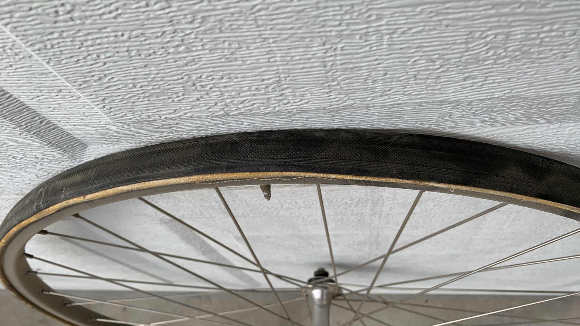 Photo 1 of 2-24” MAVIC WHEELSMITH ROAD BICYCLE RIMS, ONE WITH A TIRE. BIKE PARTS.