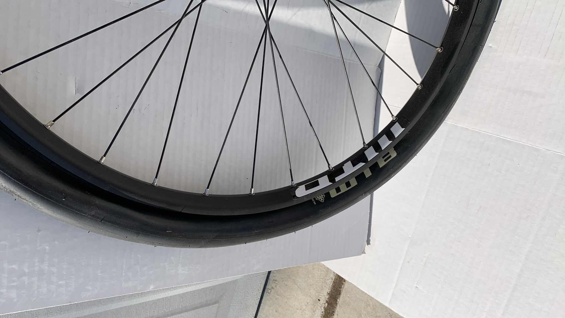 Photo 1 of 2-BICYCLE RIMS AND 1 TIRE. 27.5"D FOR A ROAD BIKE.