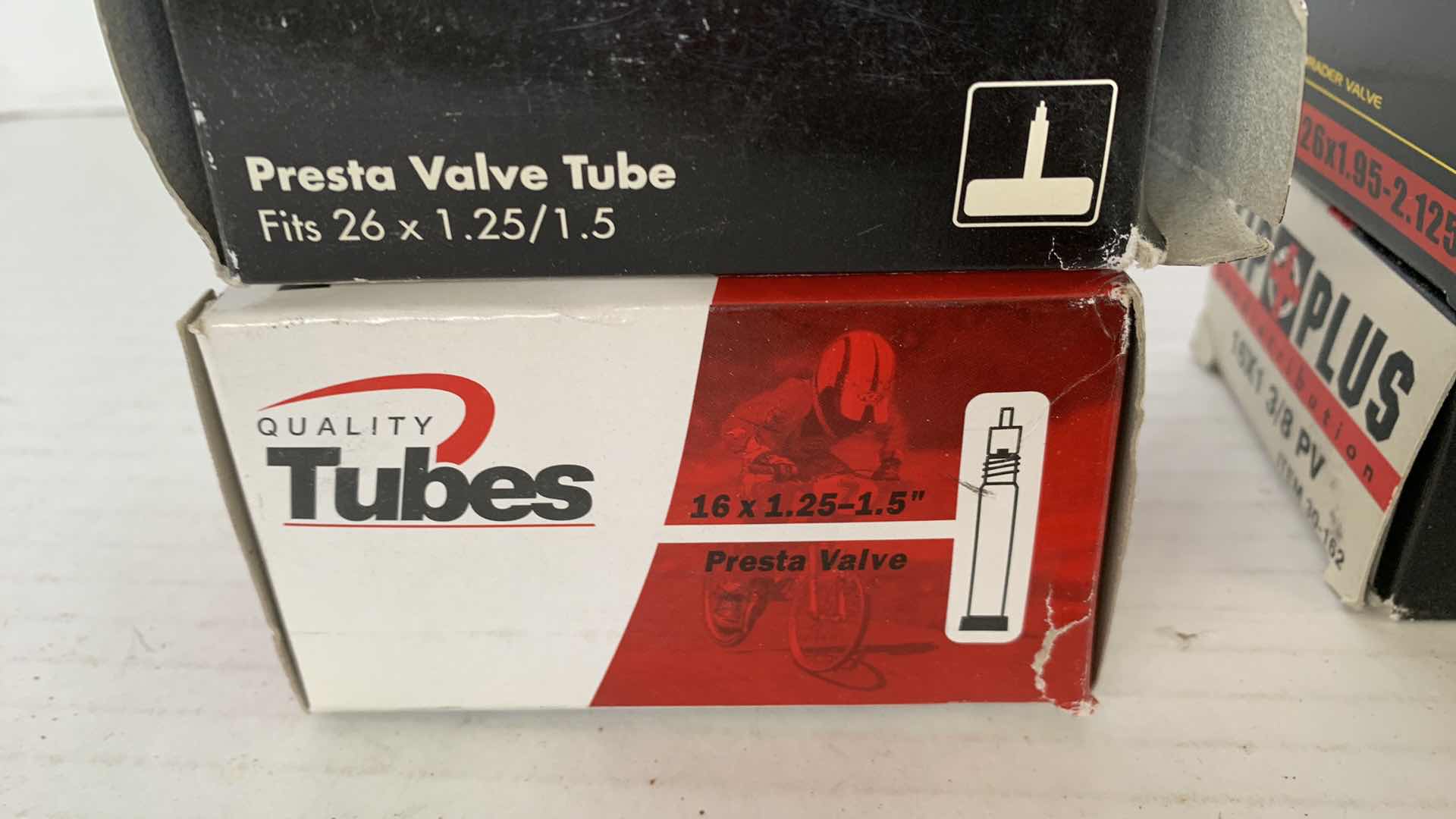 Photo 1 of 4-BICYCLE TIRE TUBES AND A RIM STRIP. PRESTO VALVE TUBE