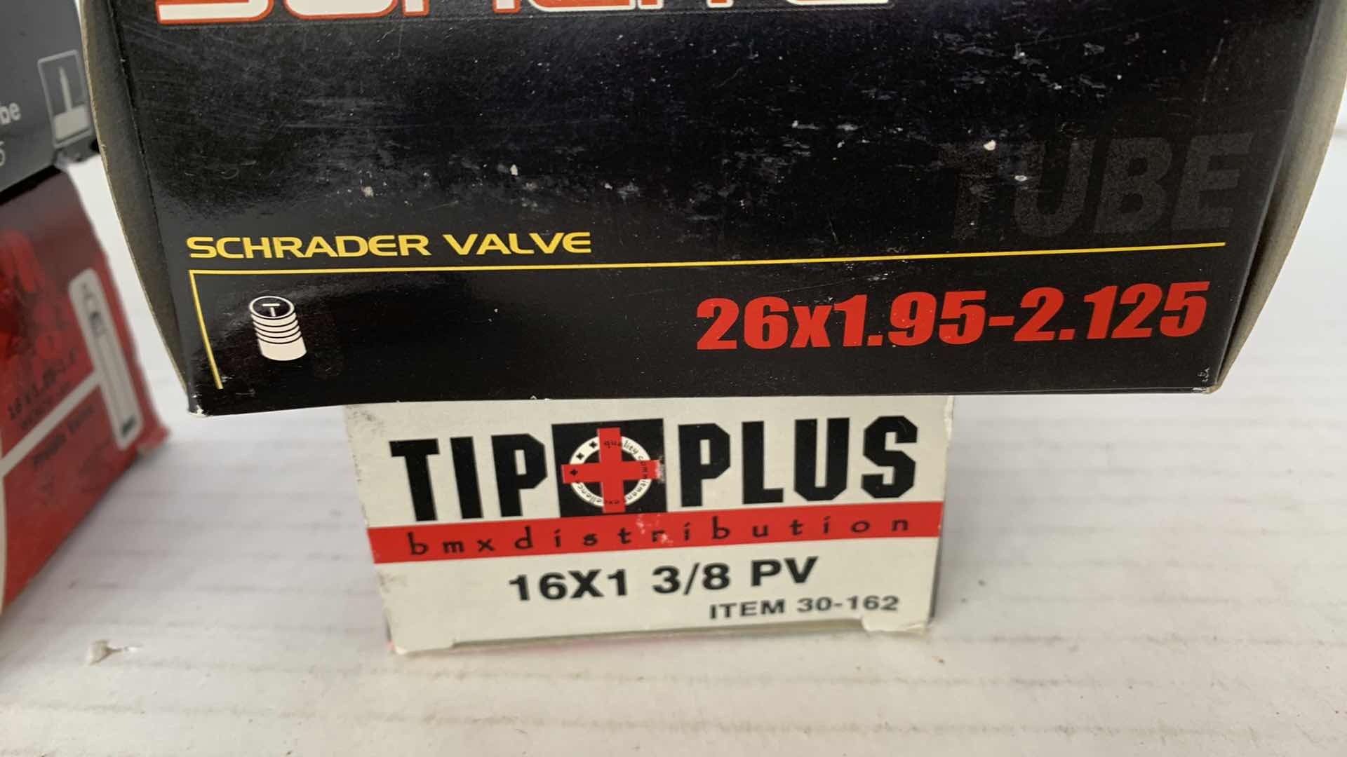 Photo 1 of 4-BICYCLE TIRE TUBES AND A RIM STRIP. PRESTO VALVE TUBE