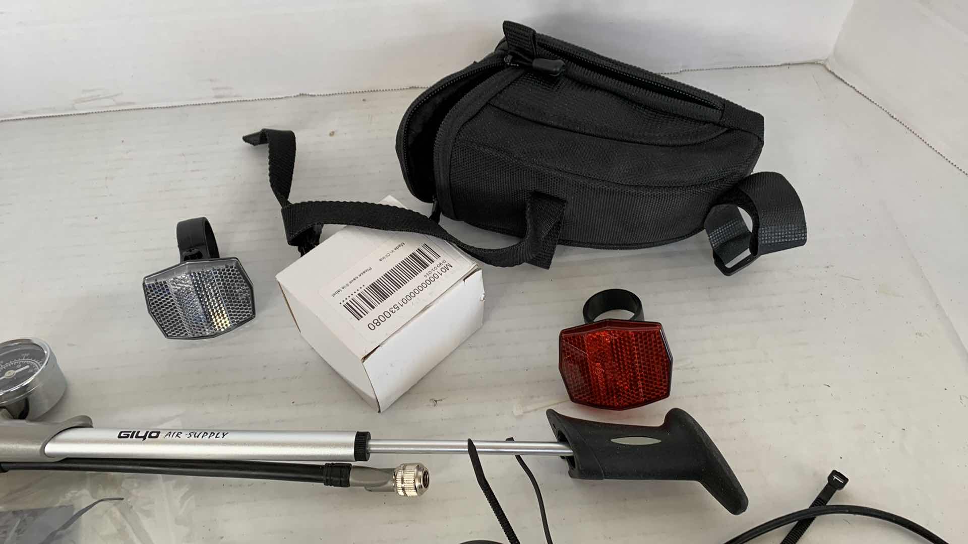 Photo 1 of ASSORTED BICYCLE PARTS AND ACCESSORIES. SPROCKET, REFLECTORS, ON PORTABLE BIKE AIR TIRE PUMP. VARIOUS TOOLS.