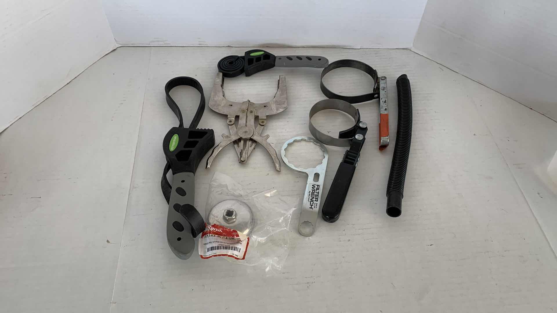 Photo 1 of AUTO PARTS.  OIL CHANGING TOOLS, FILTER WRENCHES, ETC.