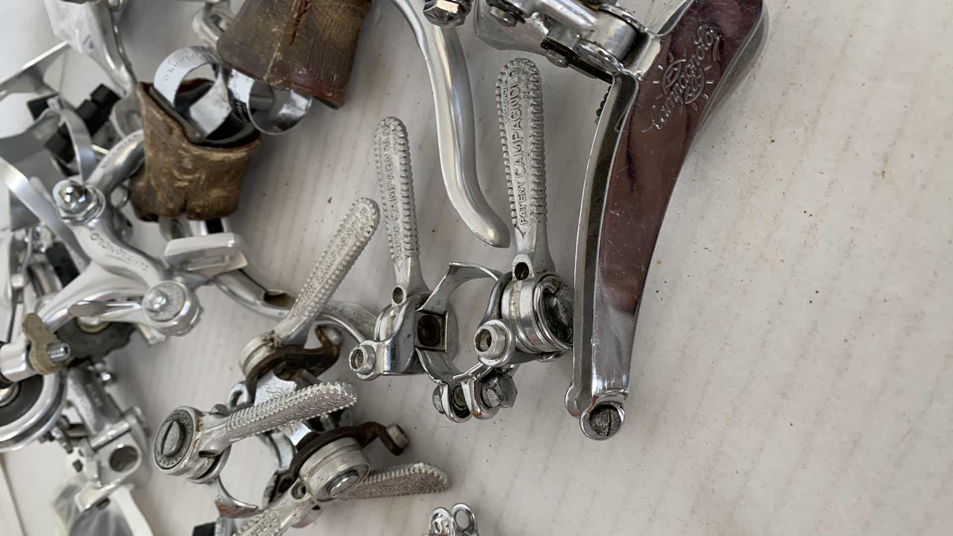 Photo 1 of BICYCLE BRAKES, FOOT STIRRUPS, AND OTHER ITEMS. ROAD BICYCLE ACCESSORIES.