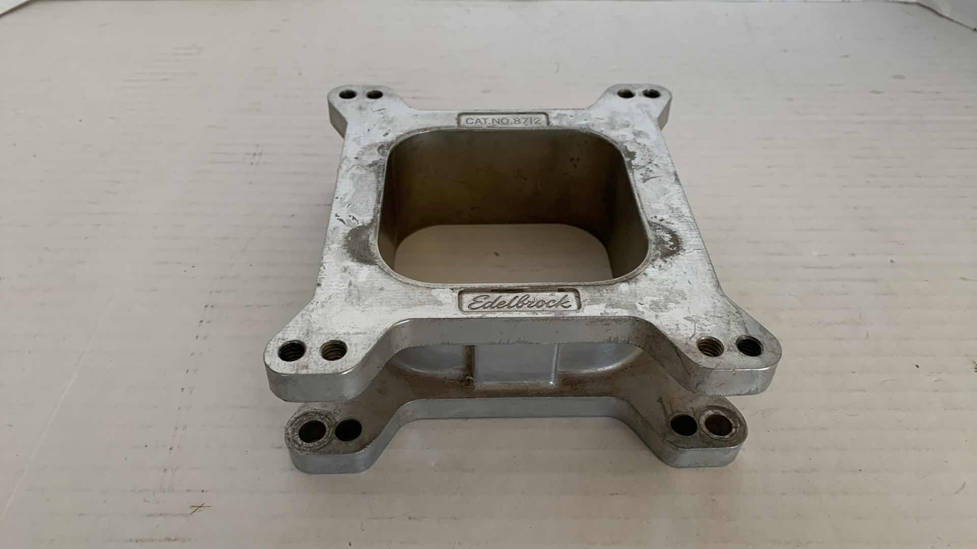 View 1 of AUTO PARTS-EDELBROCK 1 & 1/2” CARBURETOR SPACER CAT. NO. 8712