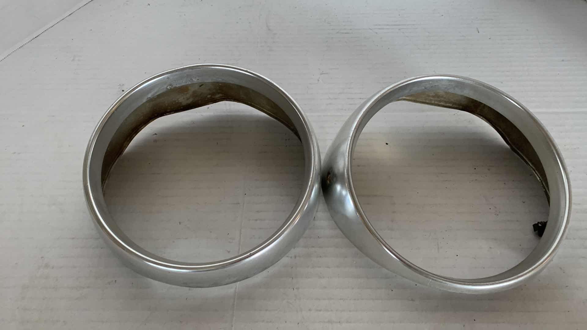 Photo 1 of AUTO PARTS- 1-PAIR OF VINTAGE 1964 FORD GALAXIE 500 HEADLIGHT RINGS.