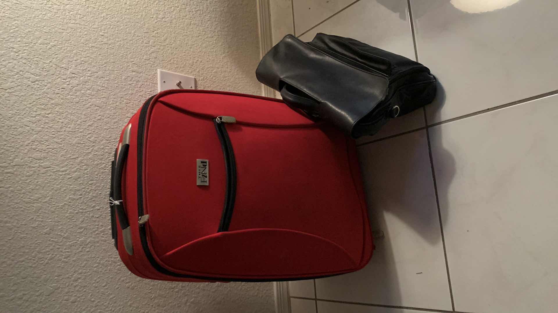 Photo 1 of CARRY ON ROLLER LUGGAGE, AND A LEATHER DOCUMENT TOTE BAG.