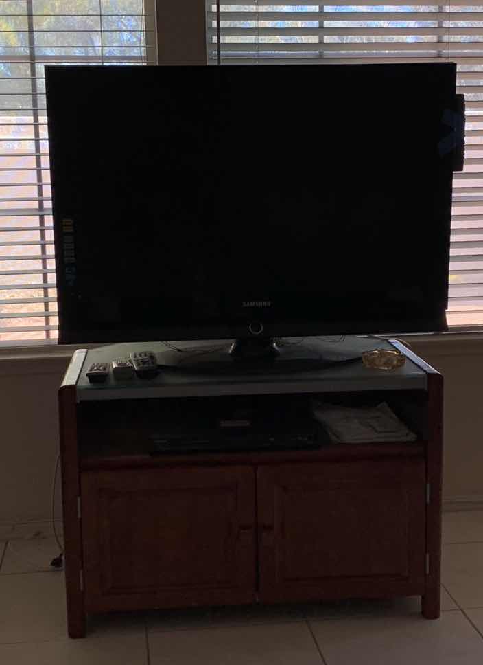 Photo 1 of SAMSUNG 40” TELEVISION WITH DVD PLAYER AND STAND