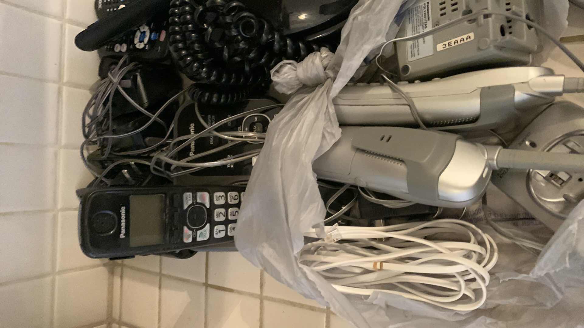 Photo 1 of PHONES AND TELEVISION REMOTES