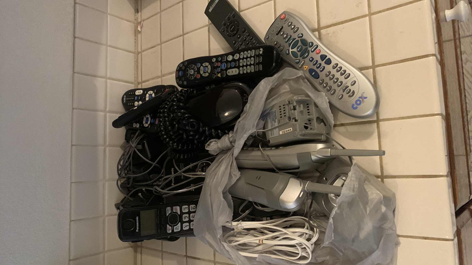 Photo 1 of PHONES AND TELEVISION REMOTES