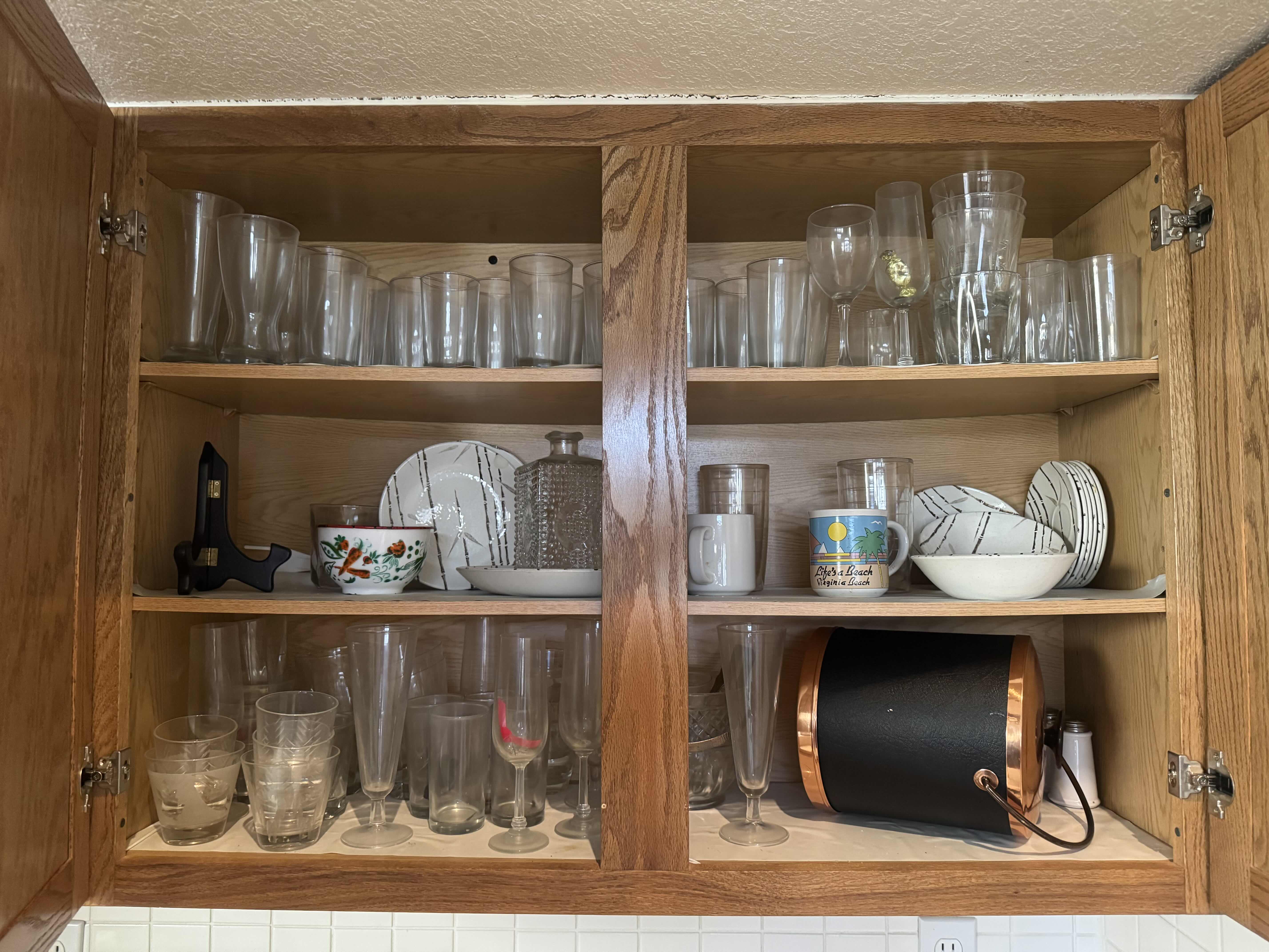 Photo 1 of CONTENTS OF KITCHEN CABINET. GLASSWARE AND BAR ACCESSORIES.