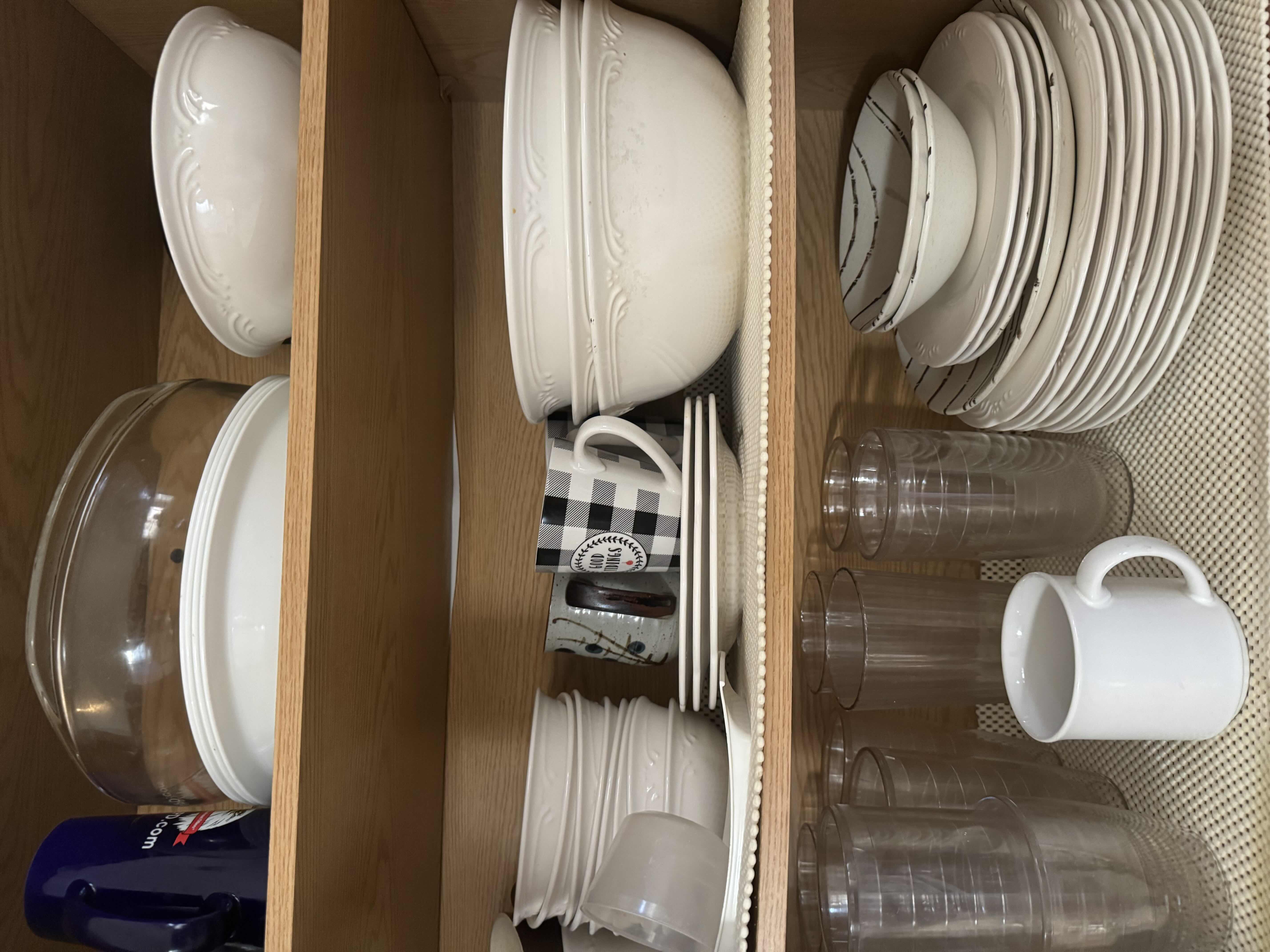 Photo 1 of CONTENTS OF KITCHEN CABINET. DISHES SET, BOWLS, PLATES, MUGS, AND GLASSES.