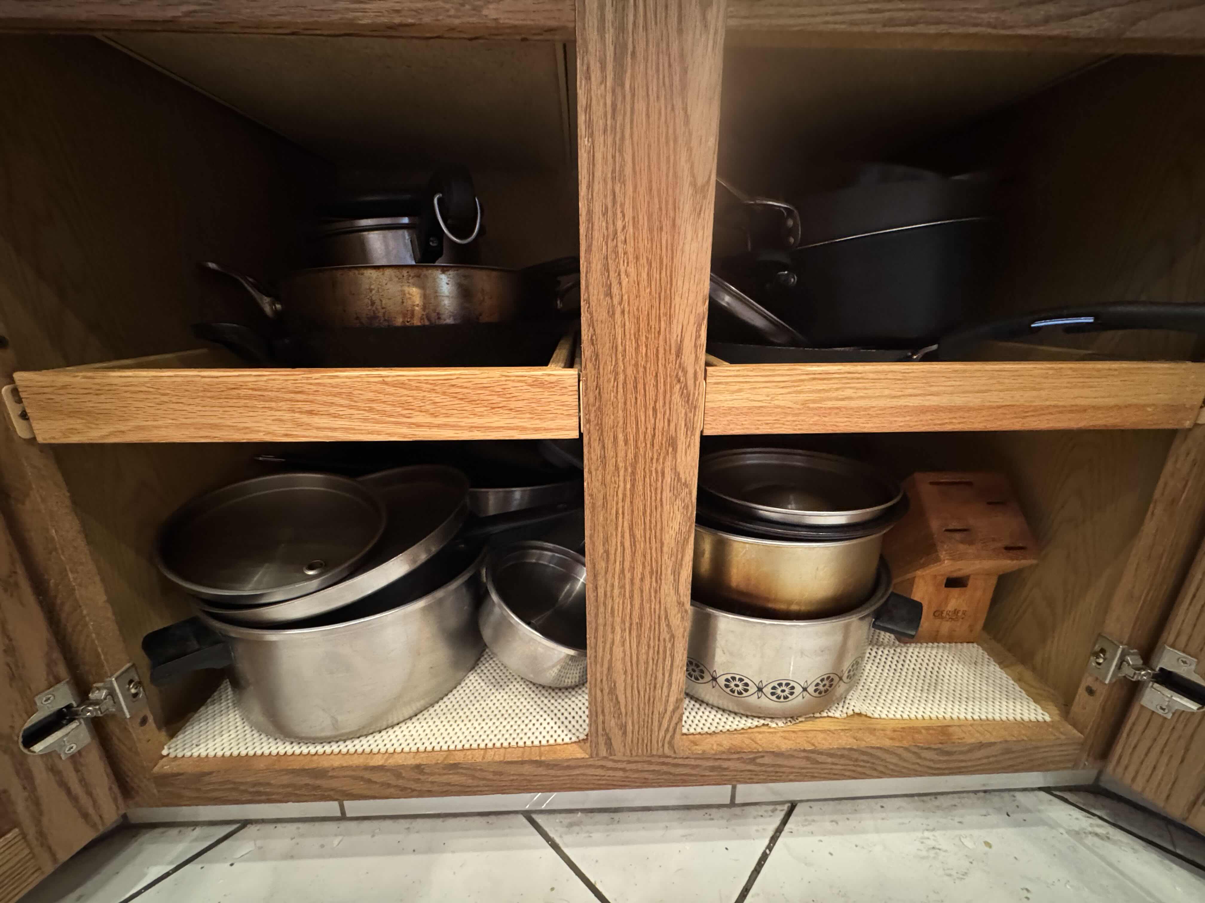 Photo 1 of CONTENTS OF KITCHEN CABINET. POTS AND PANS VARIOUS SIZES.