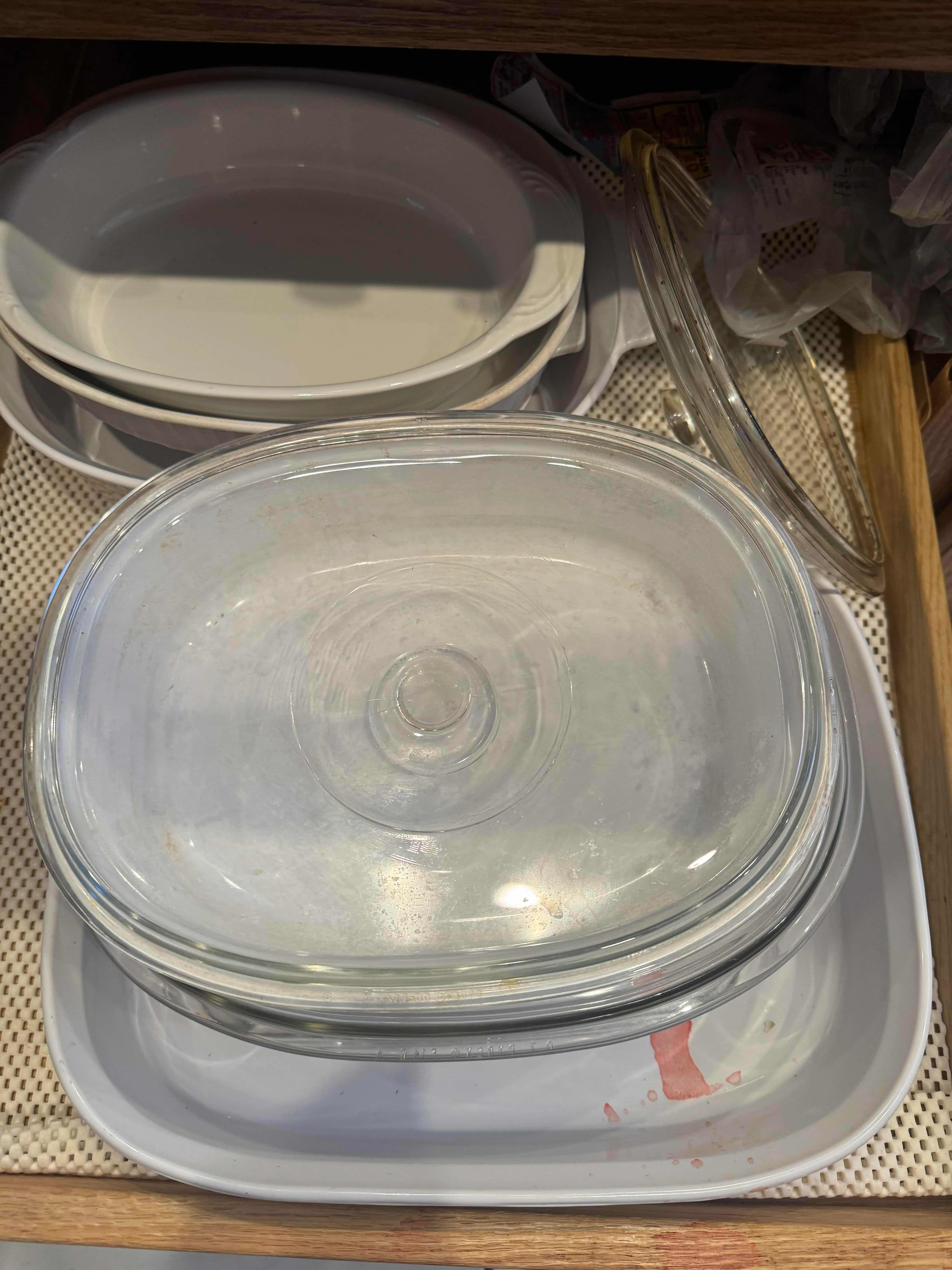 Photo 1 of CONTENTS OF KITCHEN CABINET CABINET. BAKING, SERVING AND CASSEROLE DISHES.