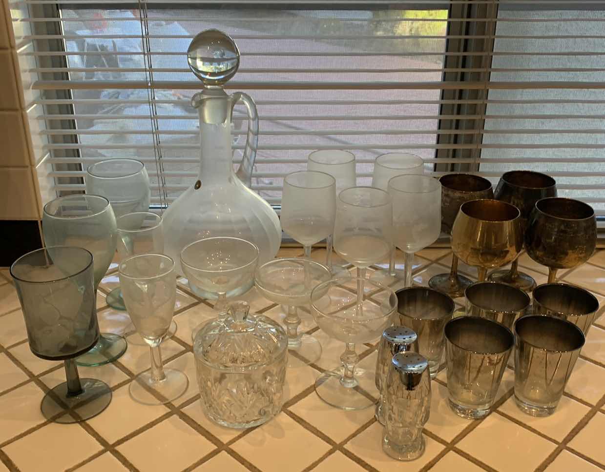Photo 1 of ASSORTED GLASS AND BARWARE. WINE DECANTER, MARTINI GLASSES, CHRYSTAL CANDY JAR WITH LID, AND SALT AND PEPPER SHAKERS.