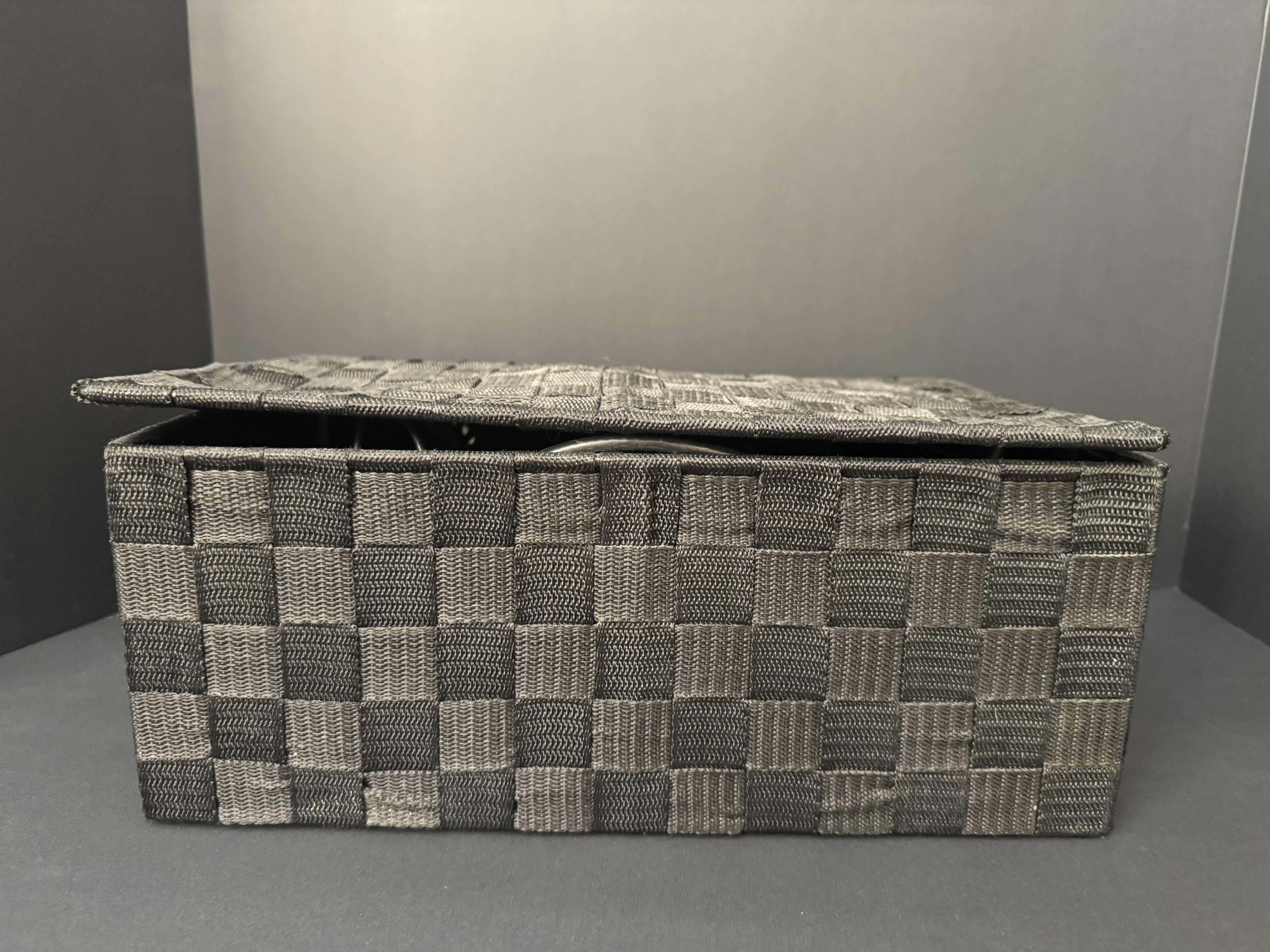 Photo 1 of BLACK WOVEN BASKET FILLED WITH ELECTRONIC CORDS AND LARGE TV LEGS, 2 PORTABLE PHONE CHARGERS & AMAZON TV HUB