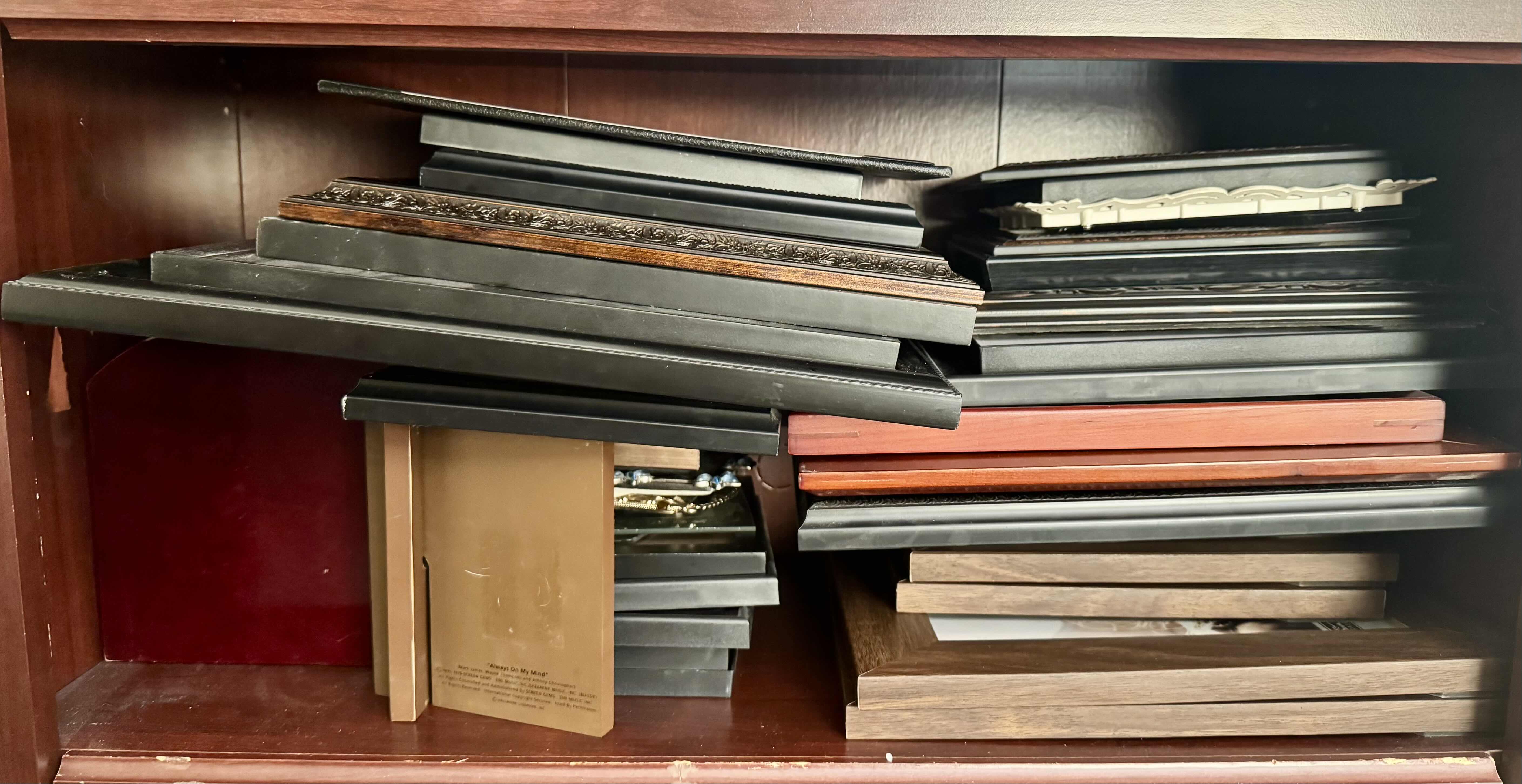 Photo 1 of CONTENTS OF SHELF (ASSORTED SIZE PICTURE FRAMES)