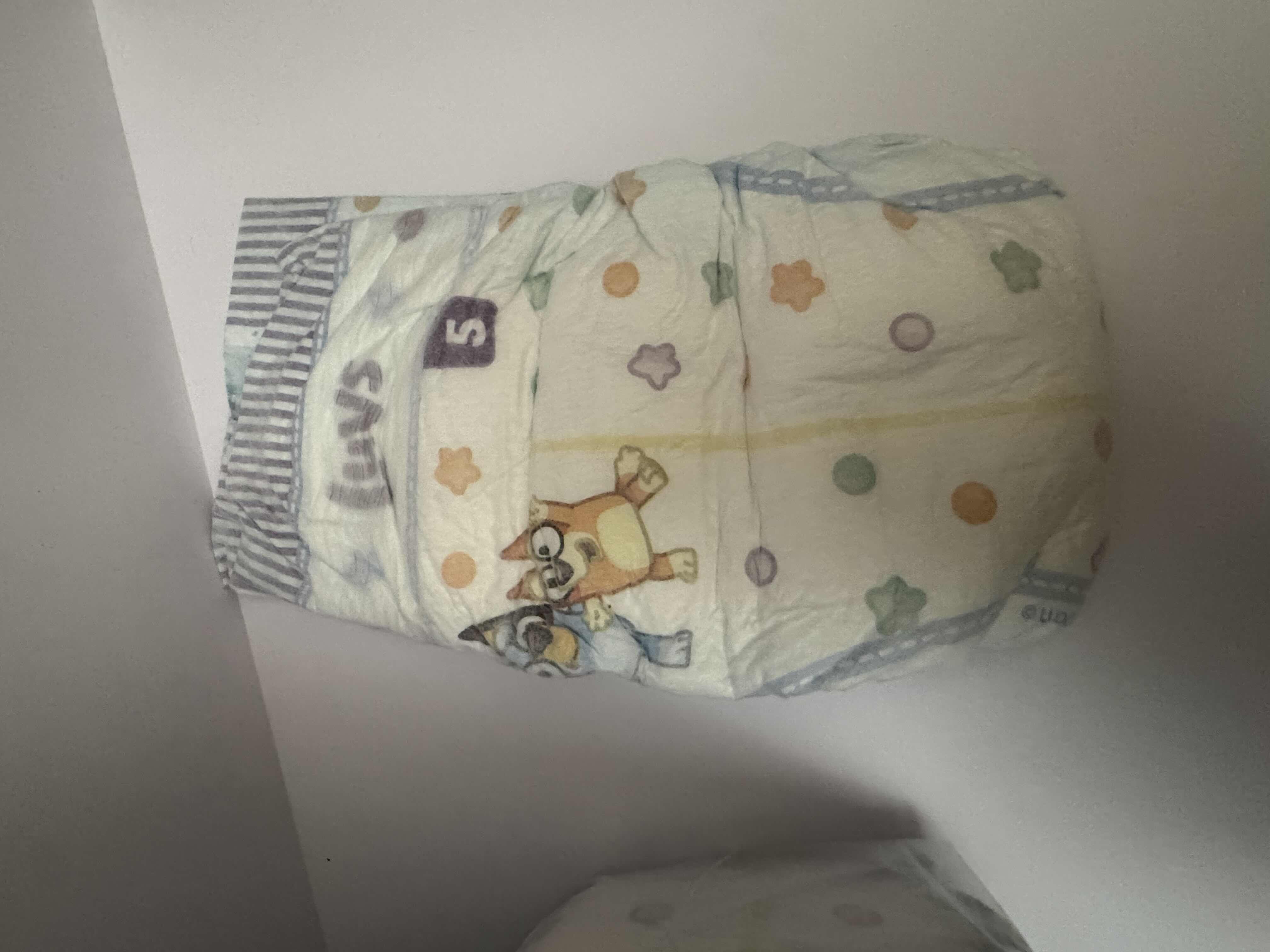 Photo 1 of 2 OPEN PACKAGES OF LUVS SIZE 5 DIAPERS