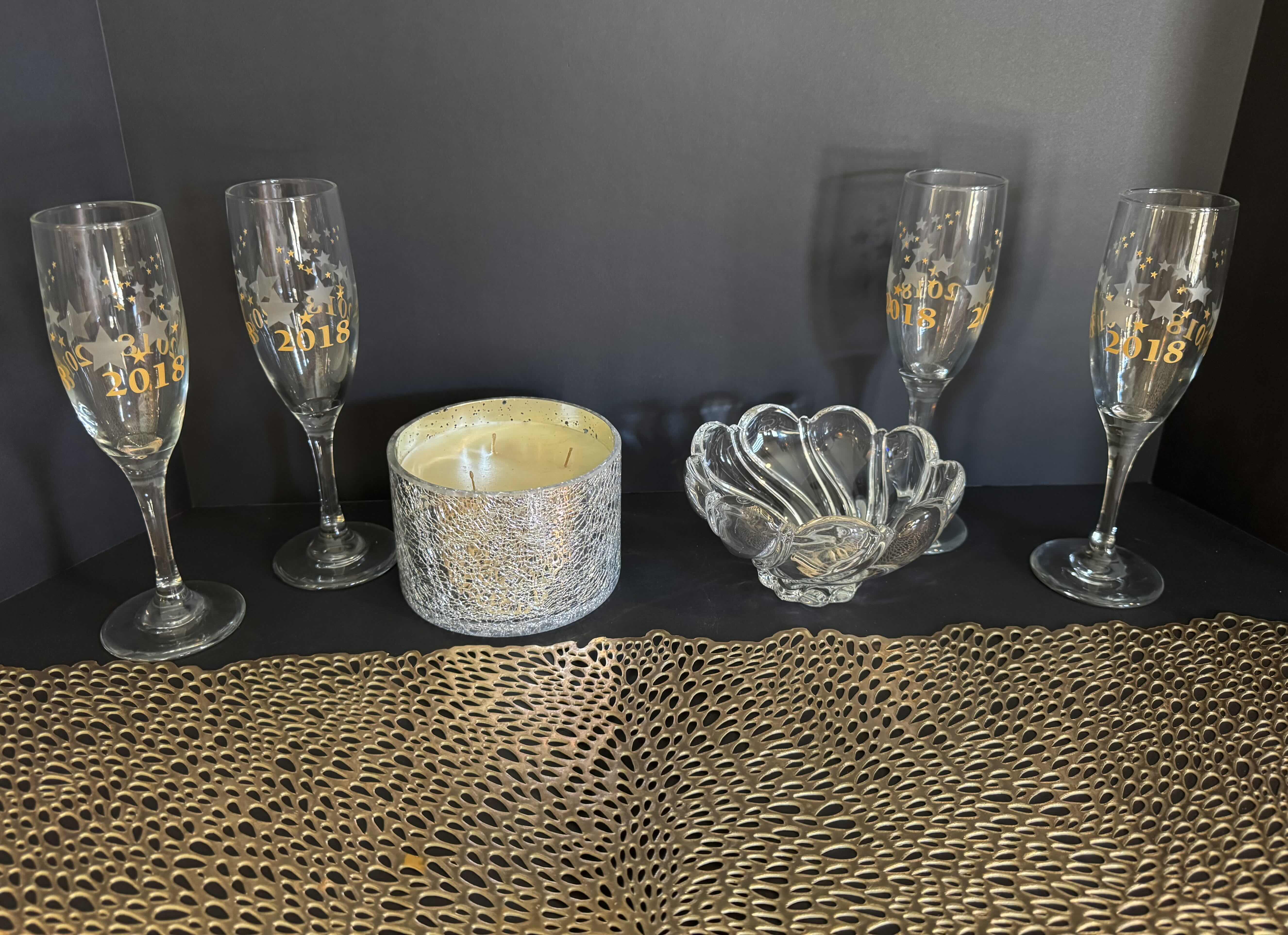 Photo 1 of HOME DECOR-NEW YEARS COMMEMORATIVE CHAMPAGNE GLASSES SET OF 4, 8”H-TABLE RUNNER 36”-CRYSTAL CANDY DISH 3”H X 5.5”D-CANDLE 3”H X 4.5”D