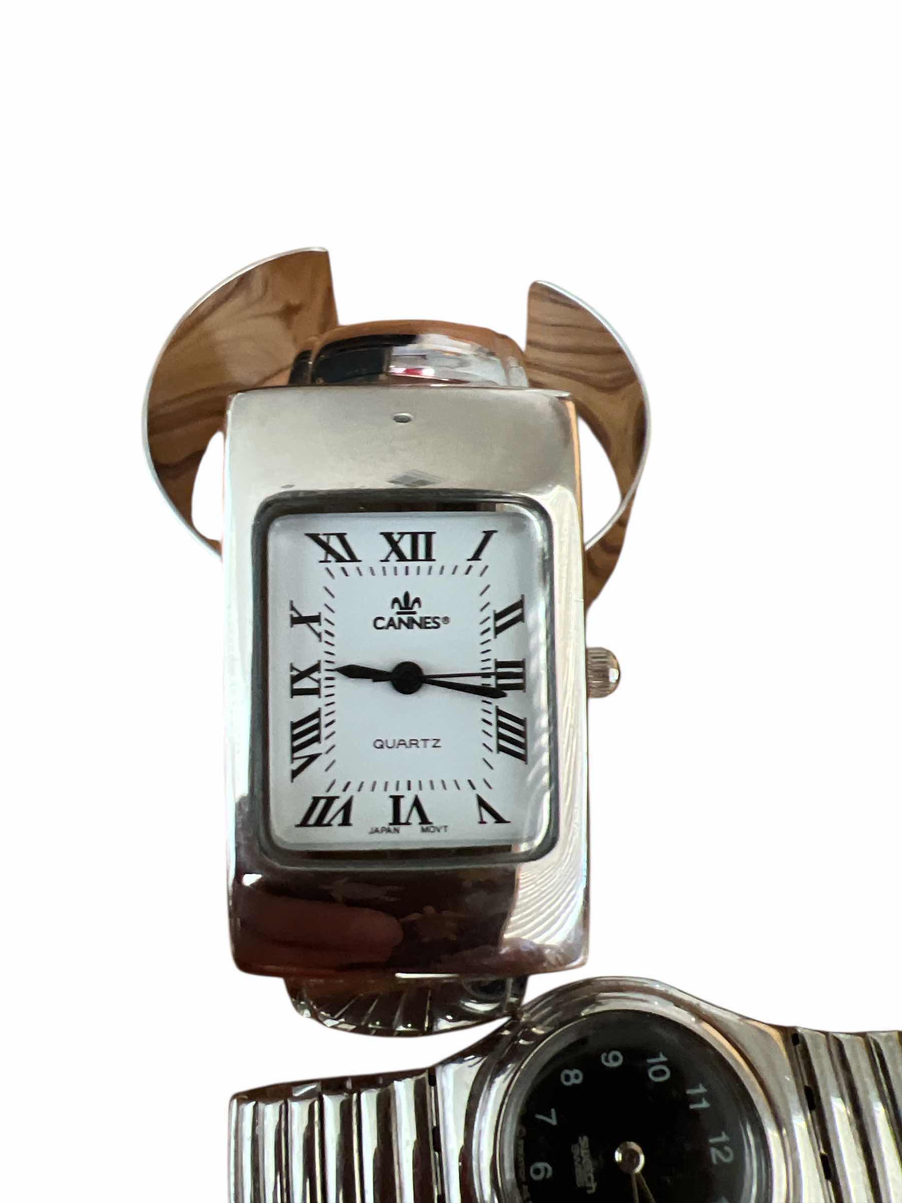 Photo 1 of 2 - WOMAN’S - SWATCH WATCH AND CANNES CUFF WATCH PLUS FRAM CUFF BRACELET