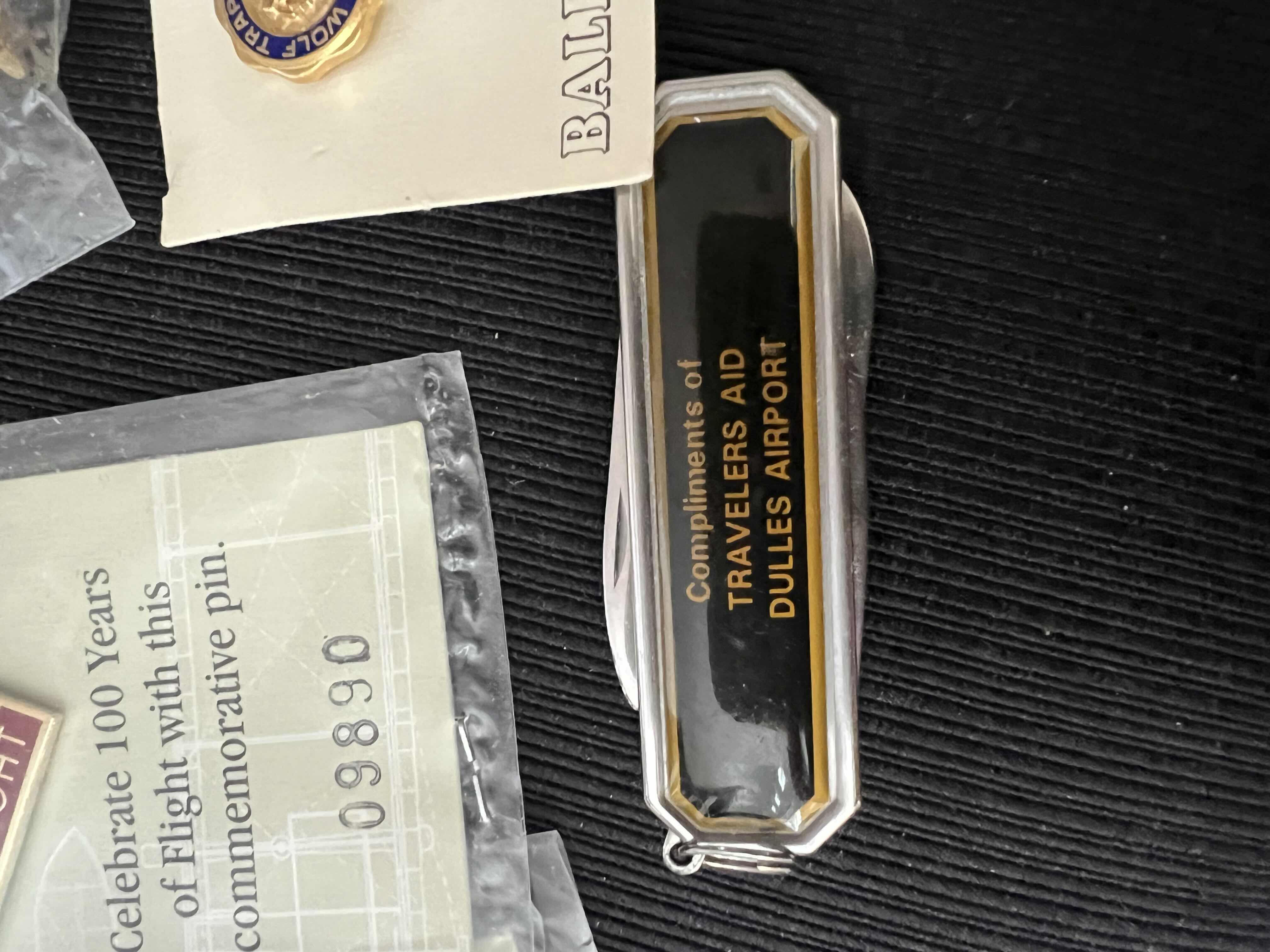 Photo 3 of TRAVEL SOUVENIRS LOT - DULLES AIRPORT POCKET KNIFE - RUSSIAN NESTING DOLL PIN AND MORE