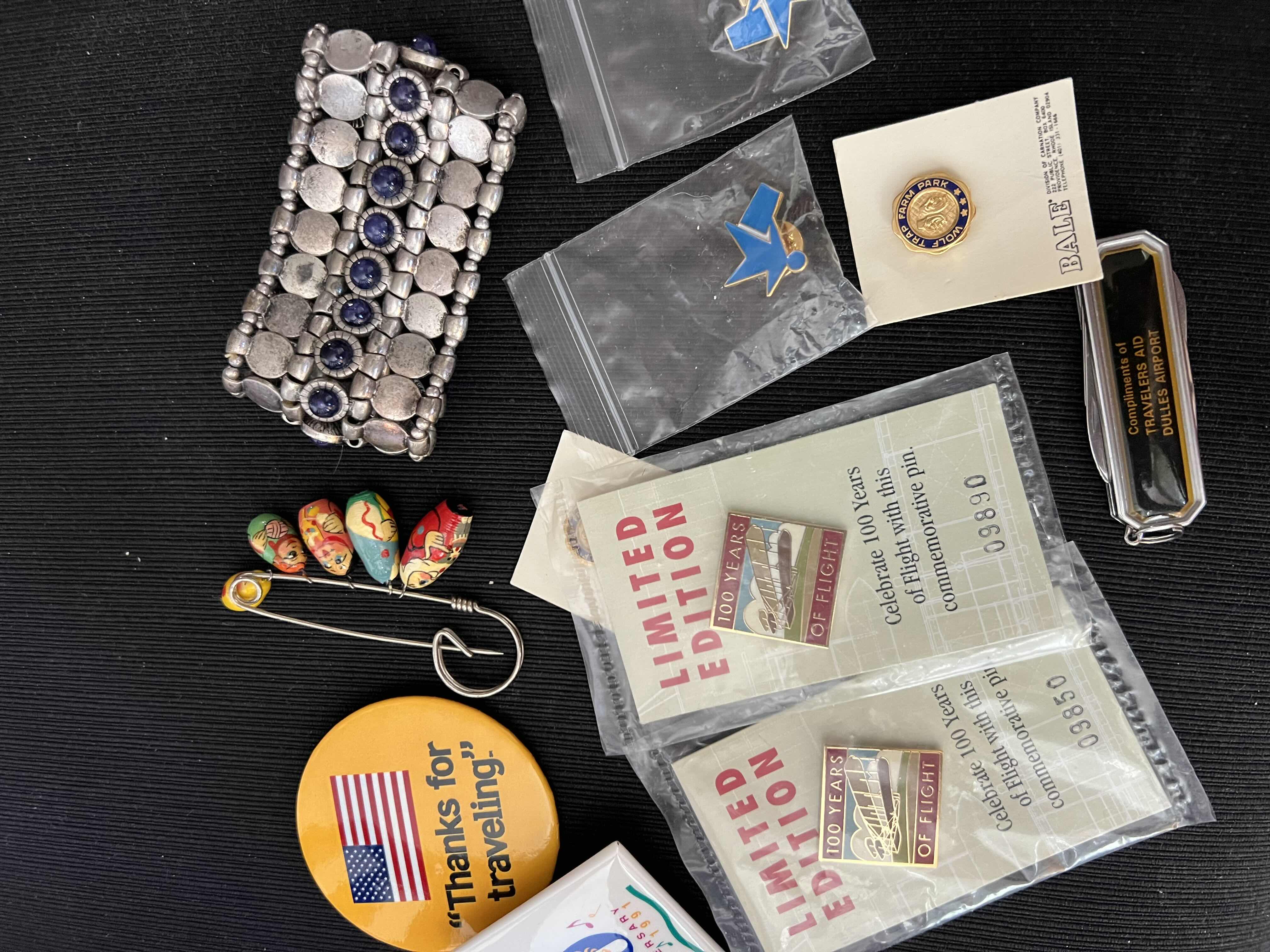 Photo 1 of TRAVEL SOUVENIRS LOT - DULLES AIRPORT POCKET KNIFE - RUSSIAN NESTING DOLL PIN AND MORE