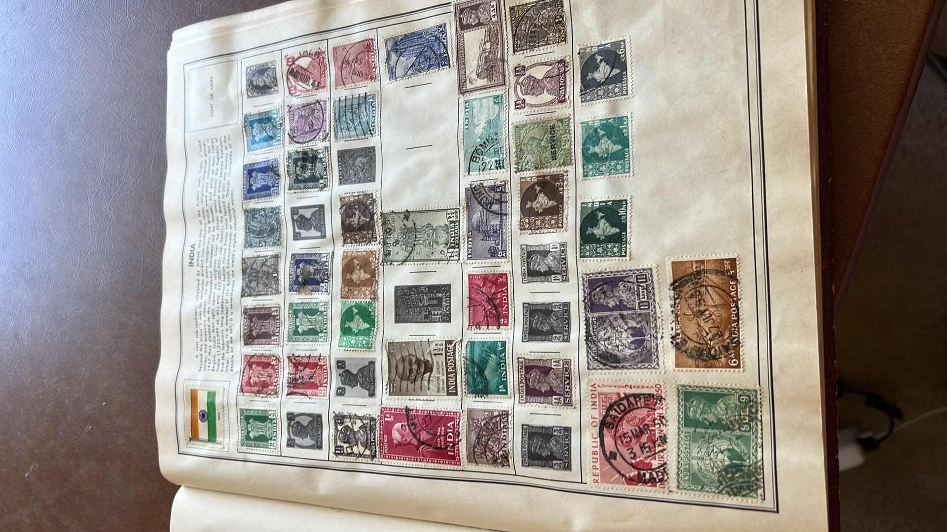 Photo 2 of “THE TRAVELERS ALBUM OF POSTAGE STAMPS OF THE WORLD”- VINTAGE - AND CONTENTS. THE BOOK IS FAIRLY FULL.  MOST STAMPS ARE CANCELLED. PLUS ADDITIONAL” STAMPS OF THE WORLD” BINDER WITH ADDITIONAL STAMPS - NO RETURNS