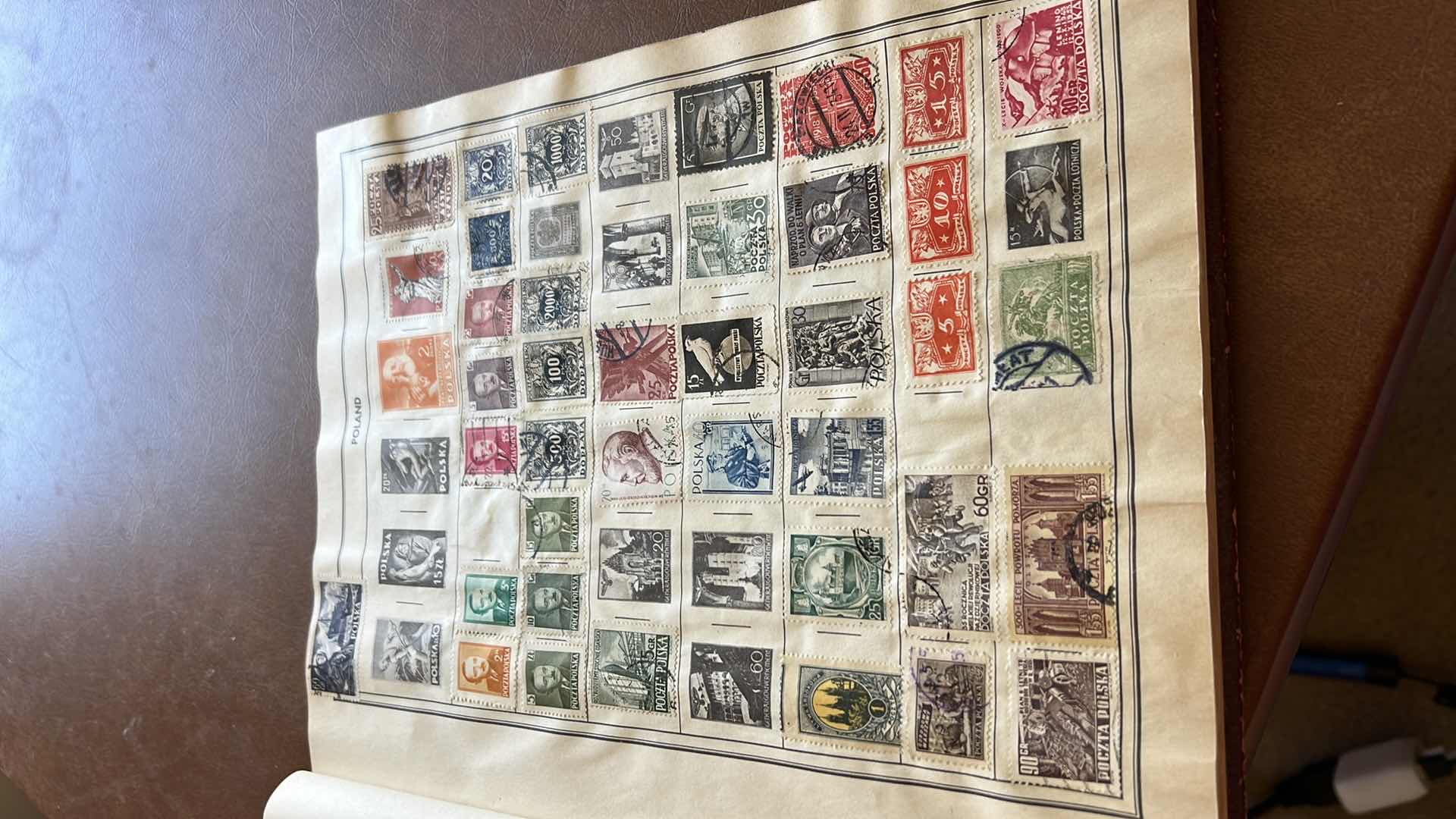 Photo 4 of “THE TRAVELERS ALBUM OF POSTAGE STAMPS OF THE WORLD”- VINTAGE - AND CONTENTS. THE BOOK IS FAIRLY FULL.  MOST STAMPS ARE CANCELLED. PLUS ADDITIONAL” STAMPS OF THE WORLD” BINDER WITH ADDITIONAL STAMPS - NO RETURNS