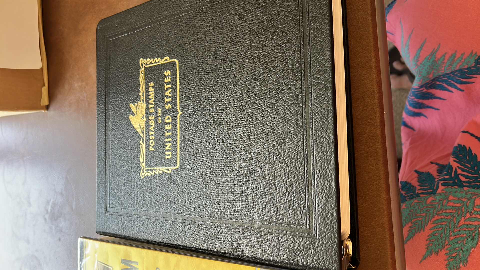 Photo 1 of “POSTAGE STAMPS OF THE UNITED STATES” ALBUM (NO CONTENT) AND “AMBASSADOR’S FOR STAMPS OF THE WORLD” SEVERAL PAGES OF MINT AND CANCELLED FOREIGN STAMPS STAMPS - NO RETURNS