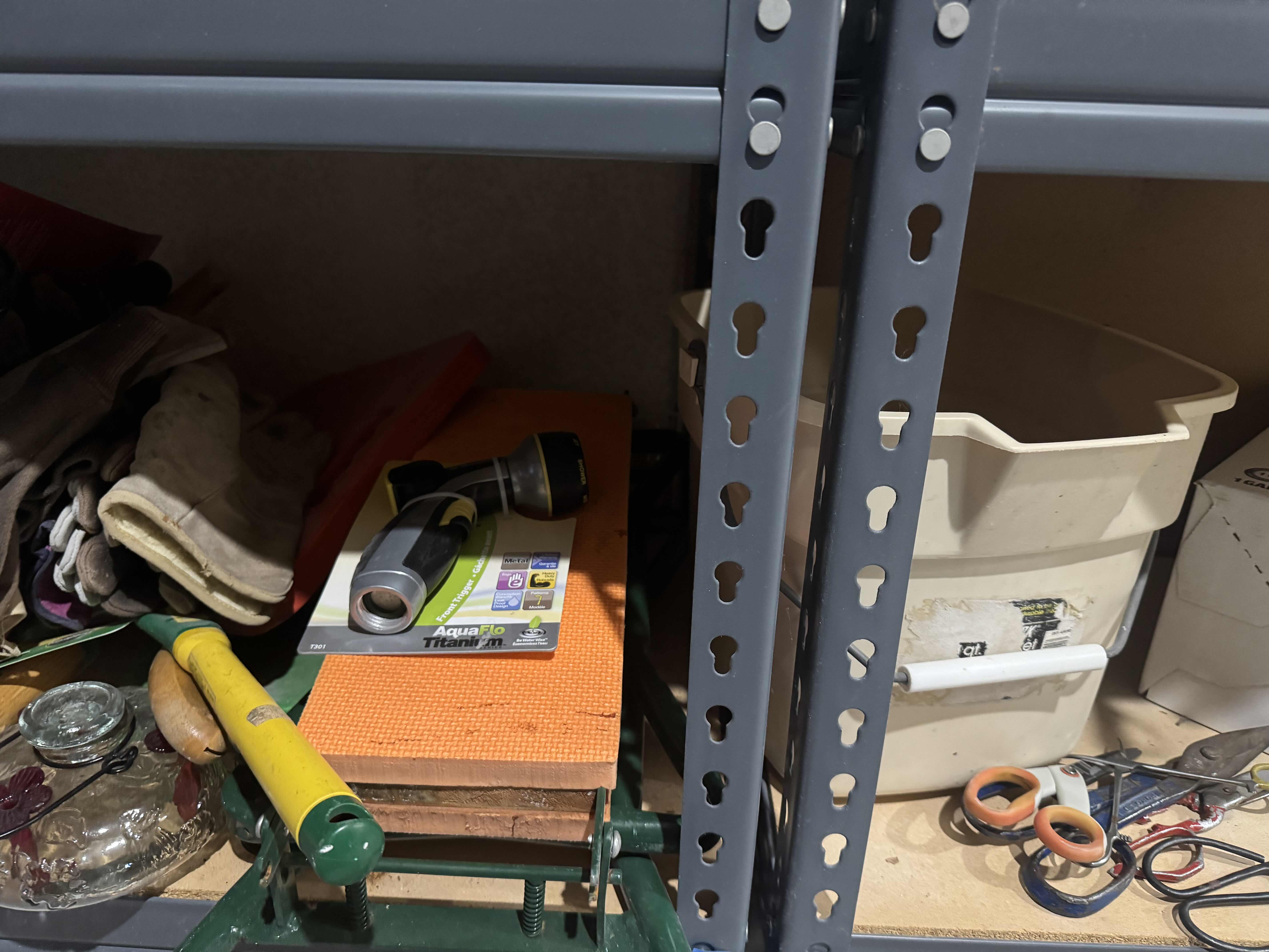 Photo 2 of 2 SHELVES OF GARDENING SUPPLIES