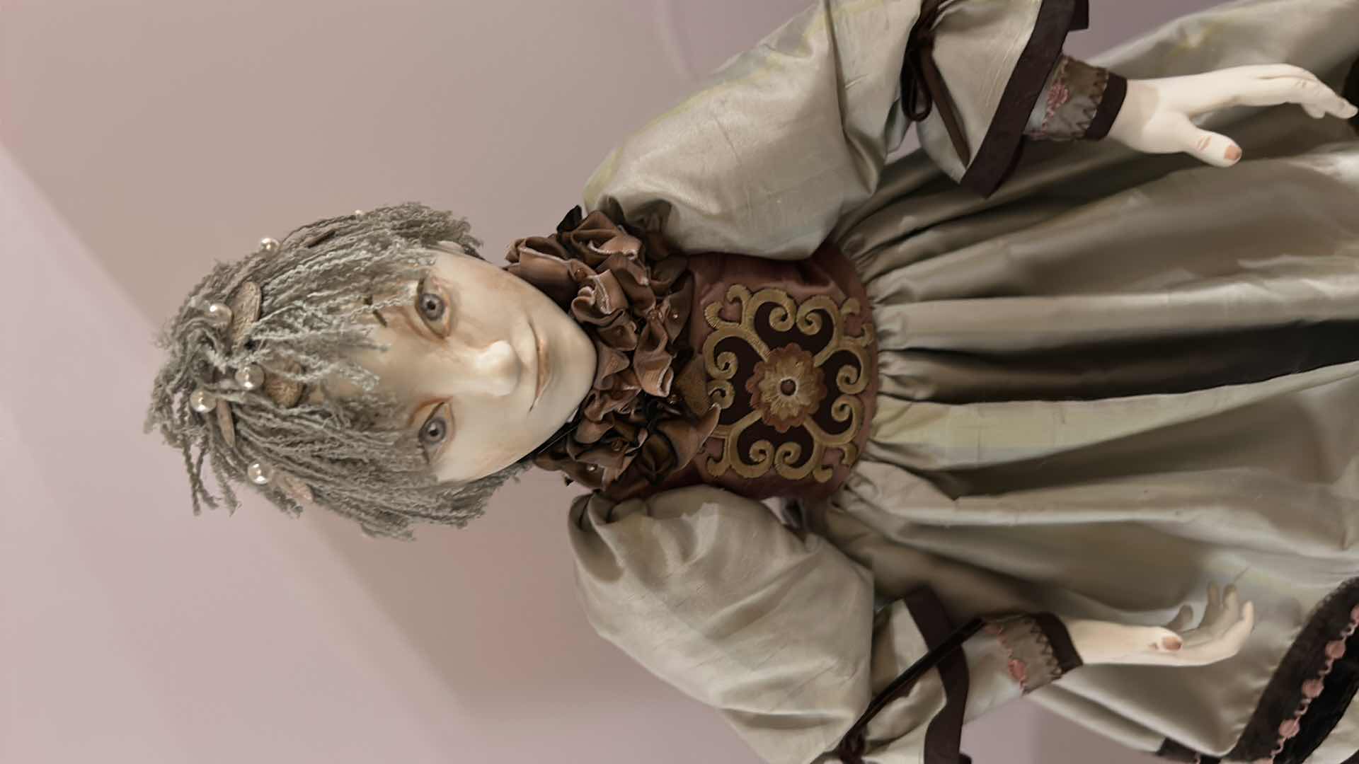 Photo 1 of PORCELAIN DOLL ON STAND 25”