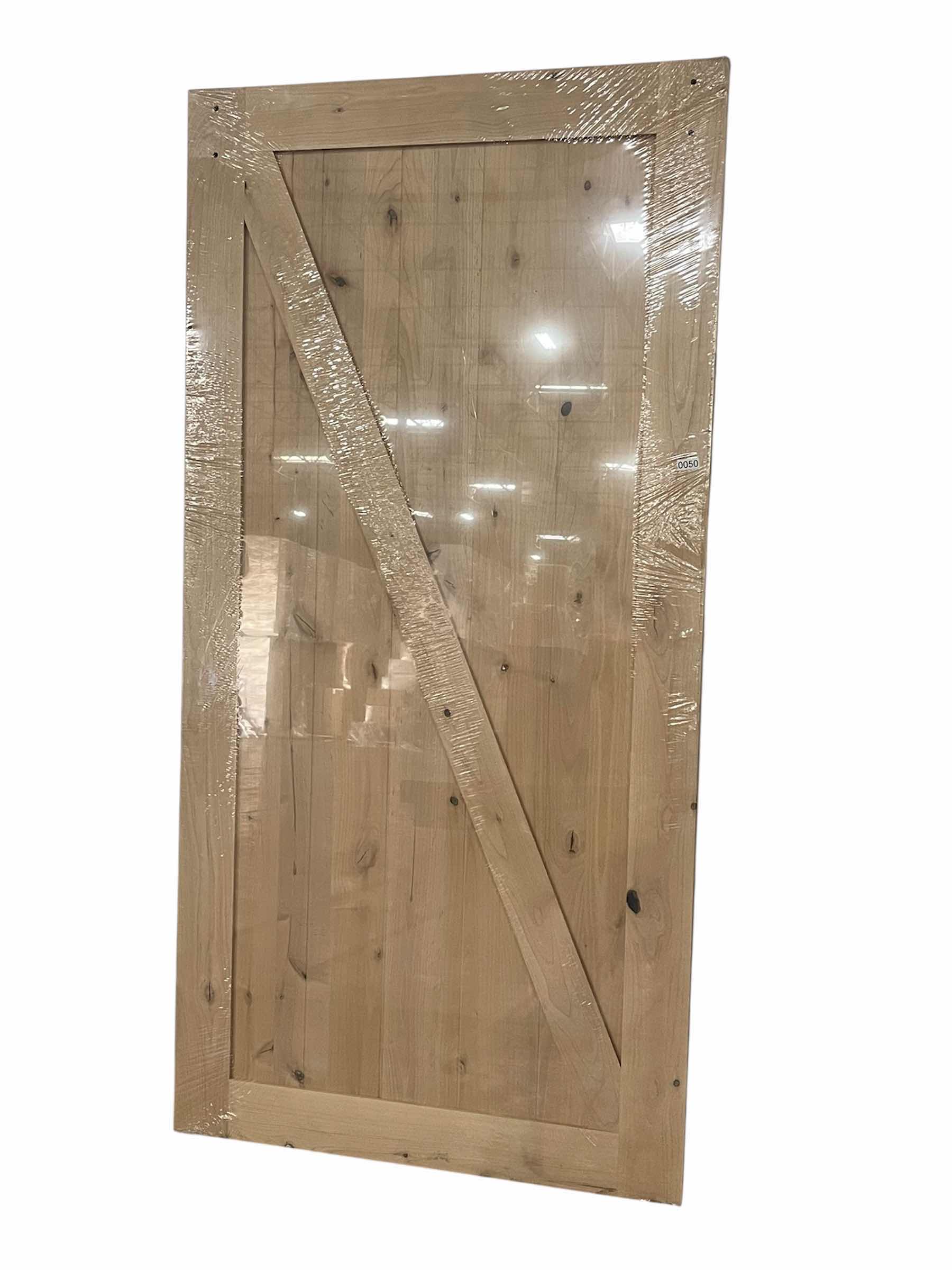 Photo 1 of NEW MASONITE Z-BAR KNOTTY ALDER WOOD INTERIOR BARN DOOR 42” X 84” (BARN DOOR ONLY)