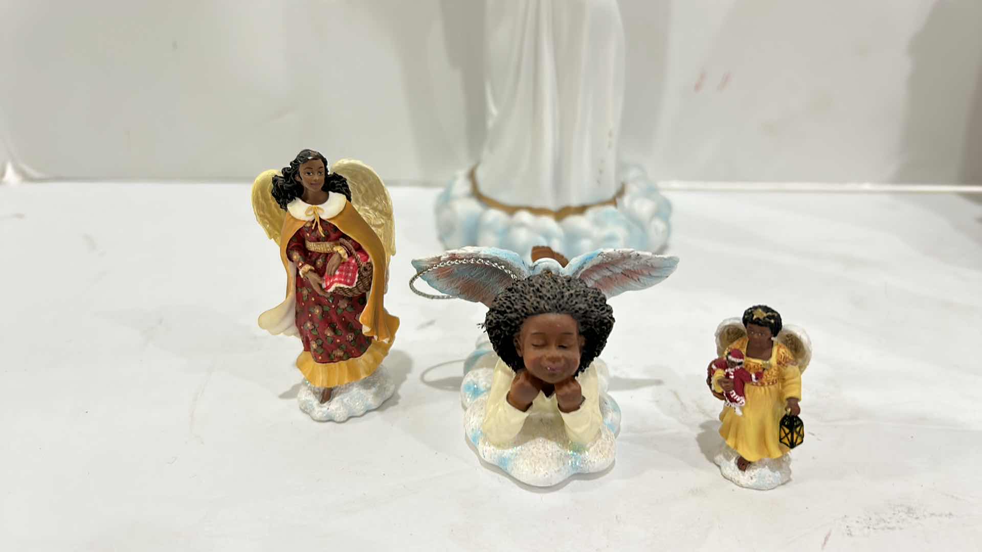 Photo 1 of ANGEL FIGURINE ASSORTMENT TALLEST 12”