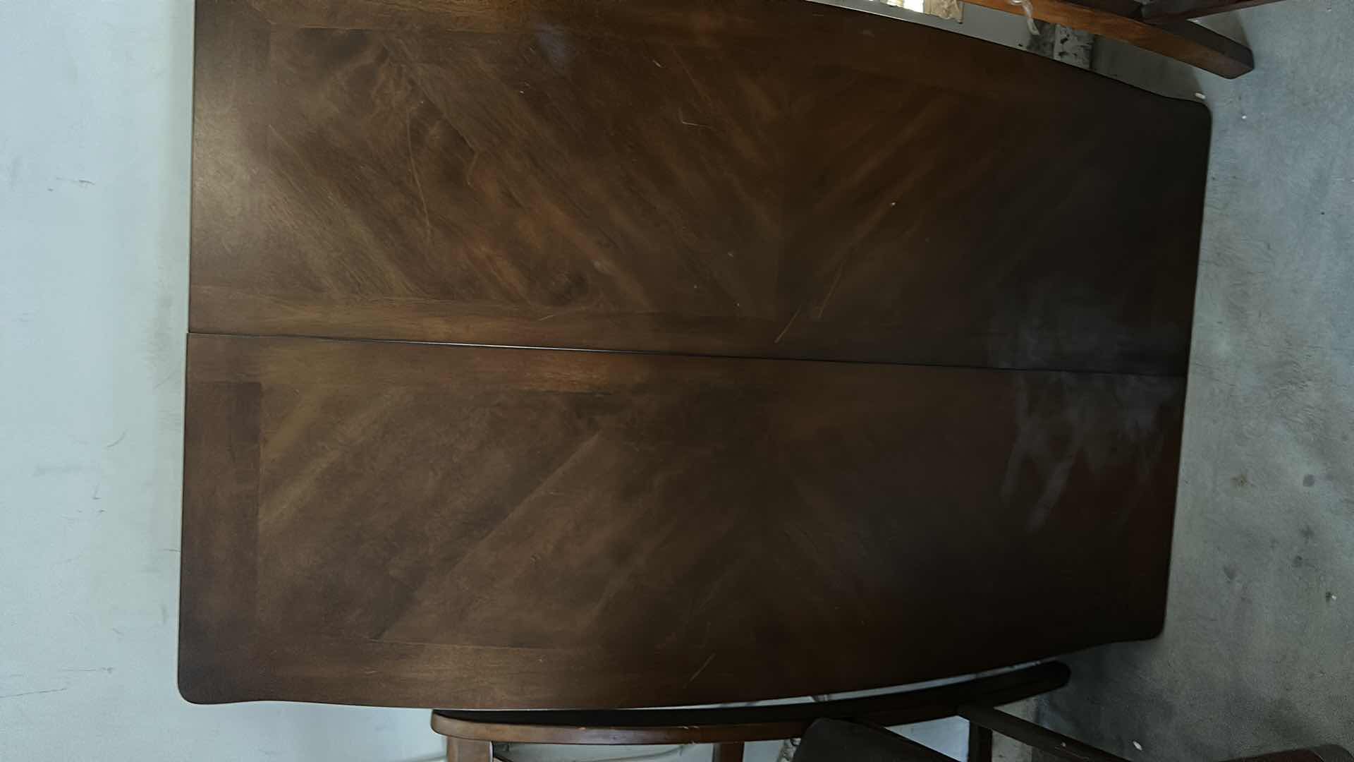 Photo 1 of ASHLEY FURNITURE WOOD BUTTERFLY LEAF DINING ROOM SET  TABLE AND 4 CHAIRS 37” x 56”