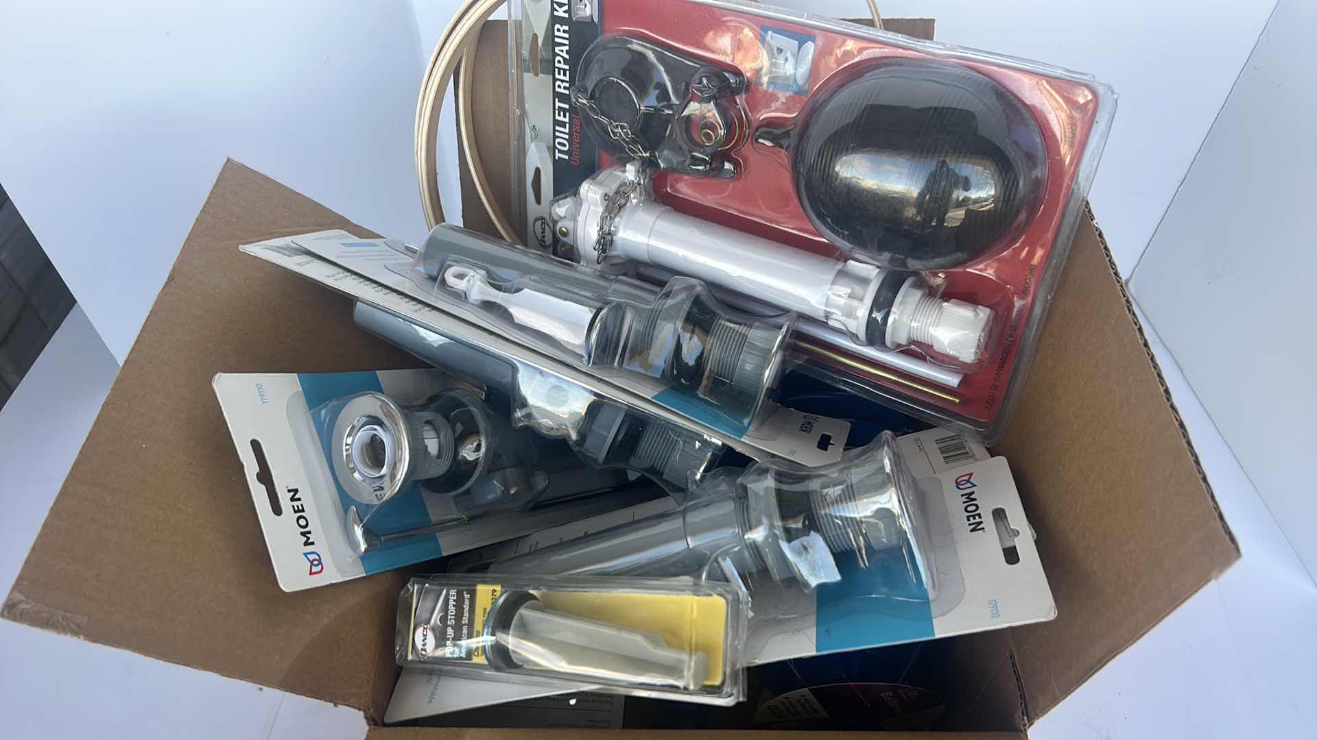 Photo 1 of BOX FULL OF TOILET AND SINK REPAIR KITS
