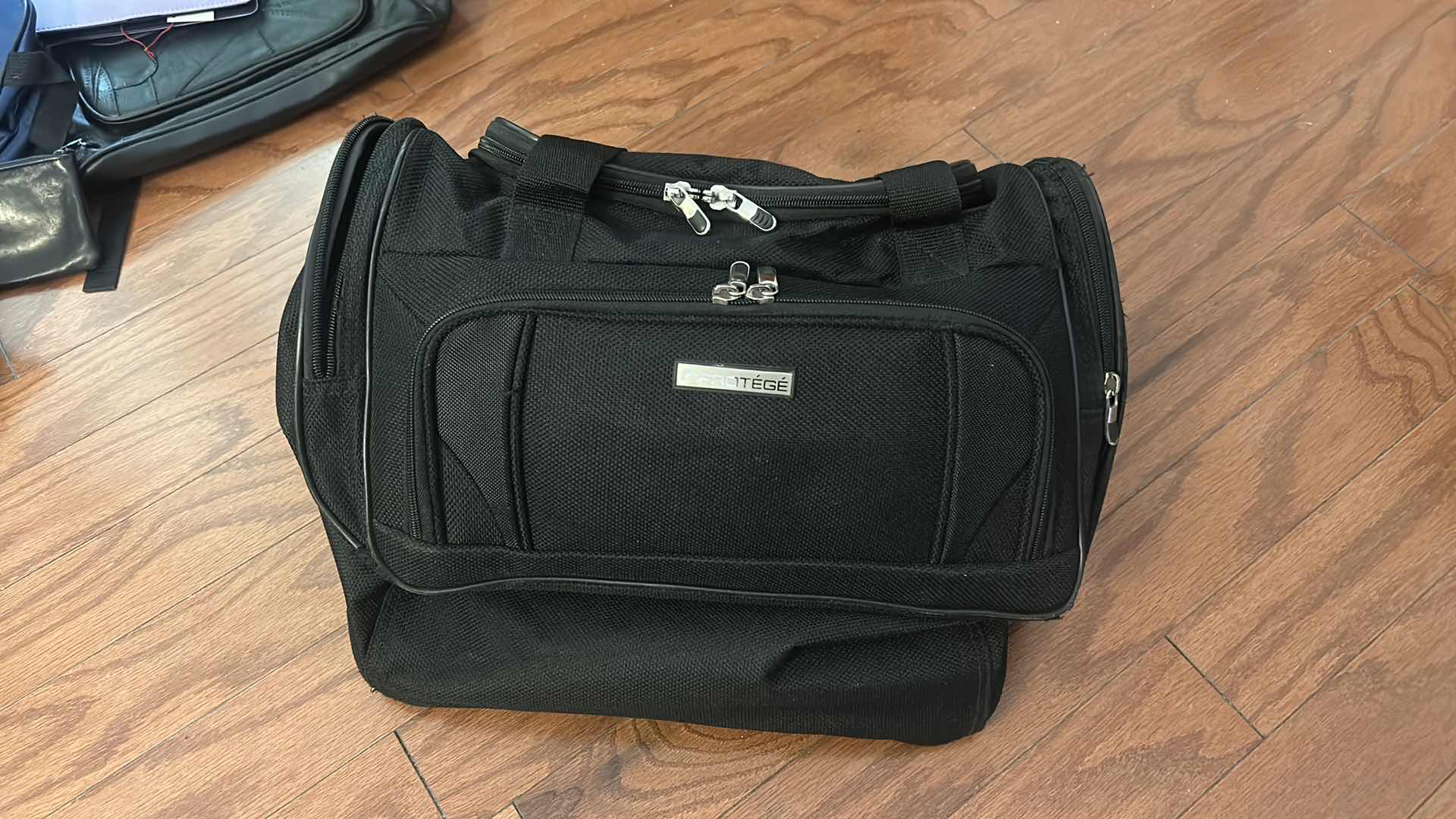 Photo 1 of BAG ASSORTMENT - TOTES, LUGGAGE, DUFFLE BAGS AND MORE