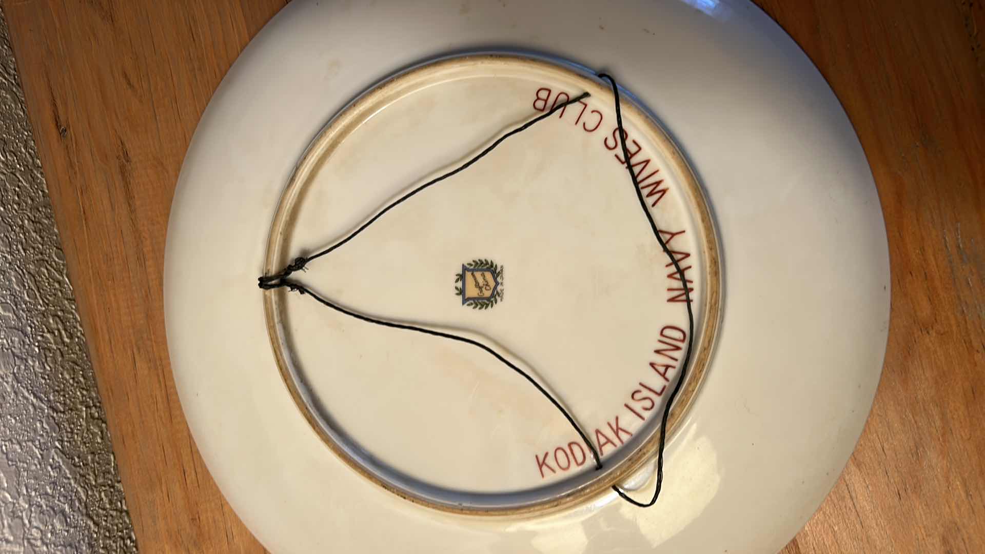 Photo 1 of 12” SIGNED PORCELAIN PLATE, ESKIMO CHILD, KODIAK ISLAND