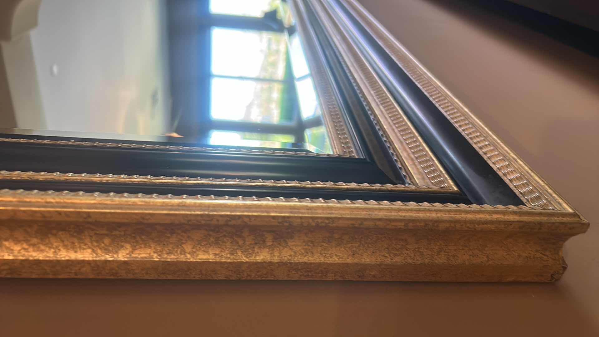 Photo 1 of VERY LARGE ORNATELY FRAMED IN GOLD AND BLACK BEVELED GLASS MIRROR 
57 inches five 44 1/2 inches