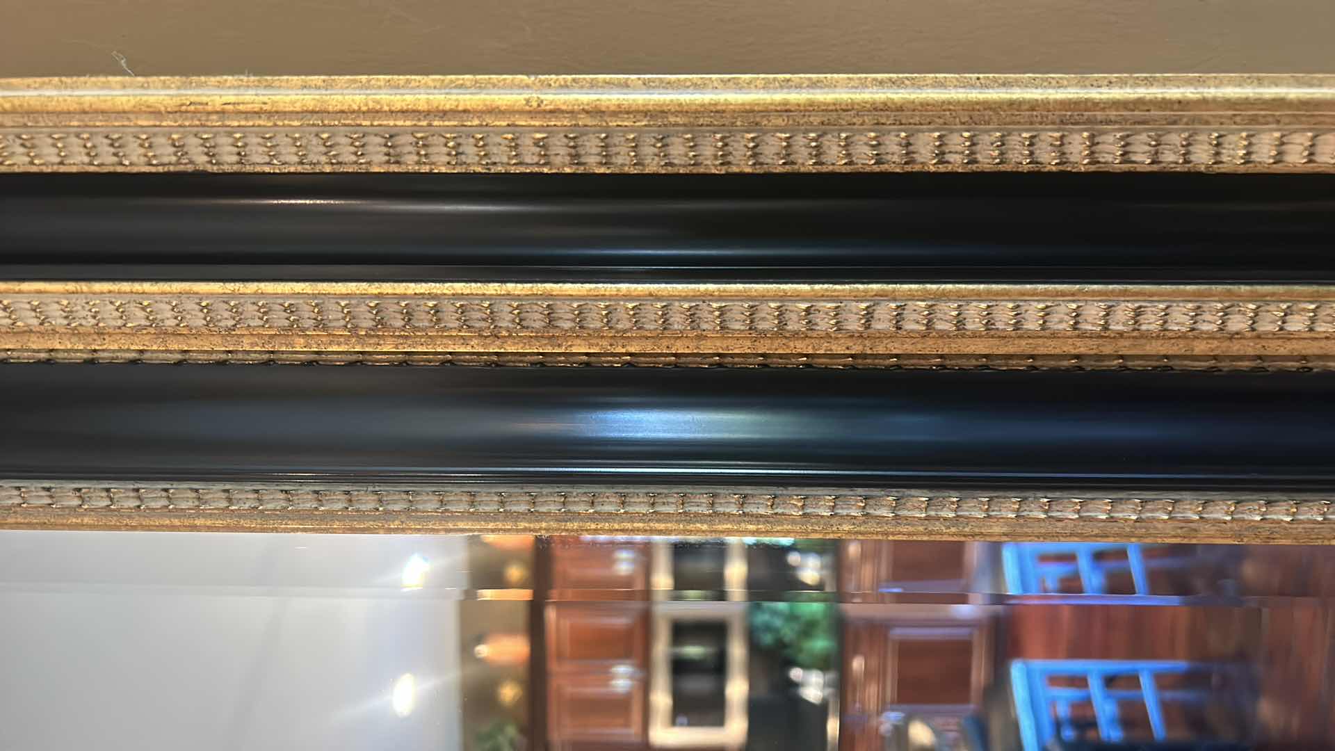 Photo 1 of VERY LARGE ORNATELY FRAMED IN GOLD AND BLACK BEVELED GLASS MIRROR 
57 inches five 44 1/2 inches