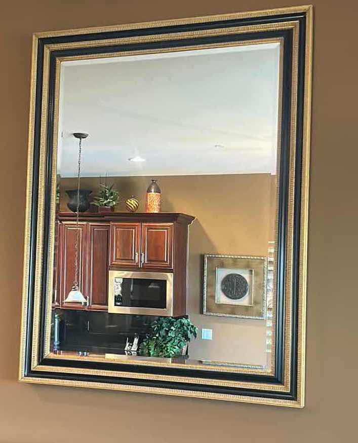Photo 1 of VERY LARGE ORNATELY FRAMED IN GOLD AND BLACK BEVELED GLASS MIRROR 
57 inches five 44 1/2 inches