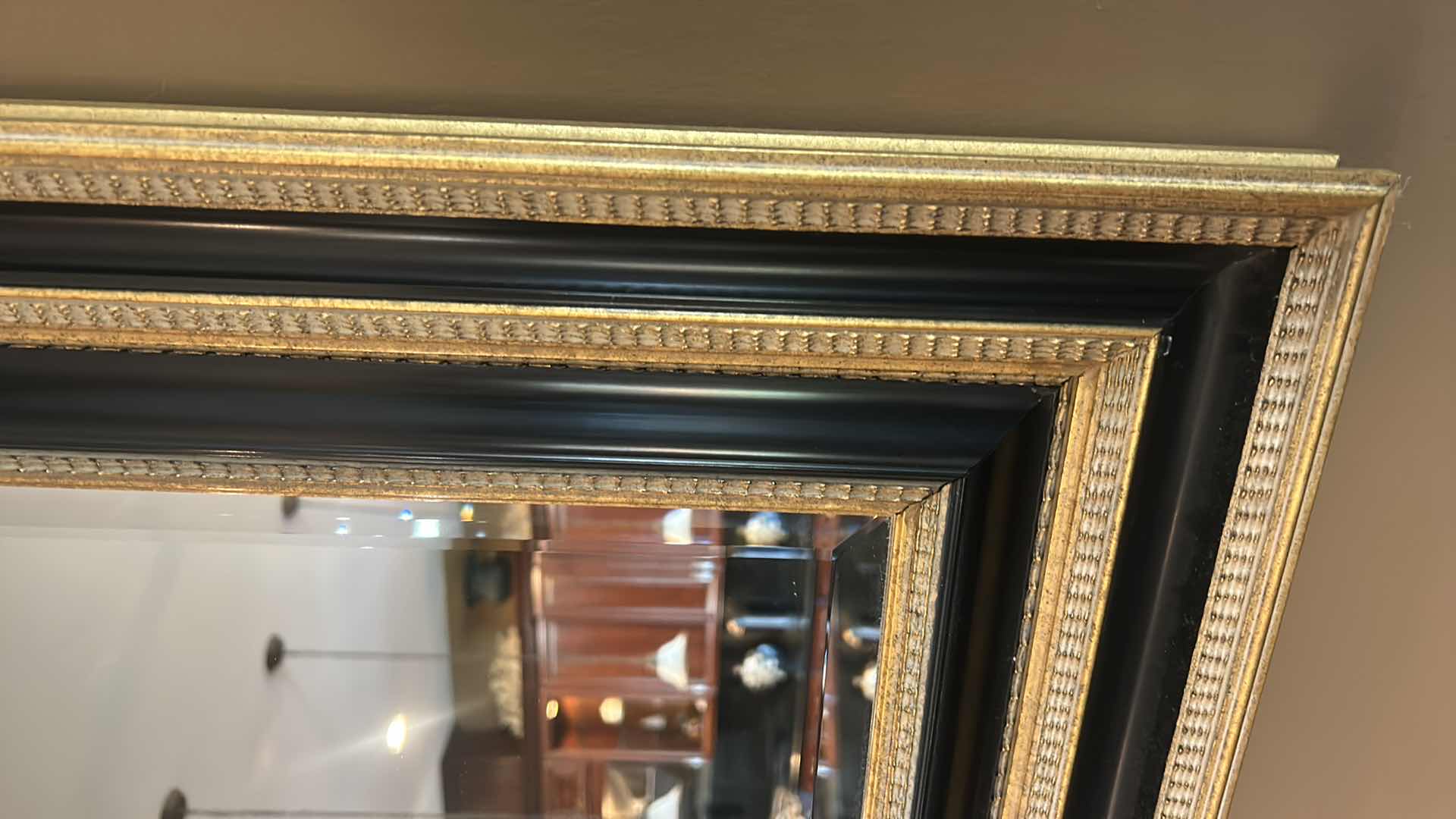 Photo 1 of VERY LARGE ORNATELY FRAMED IN GOLD AND BLACK BEVELED GLASS MIRROR 
57 inches five 44 1/2 inches