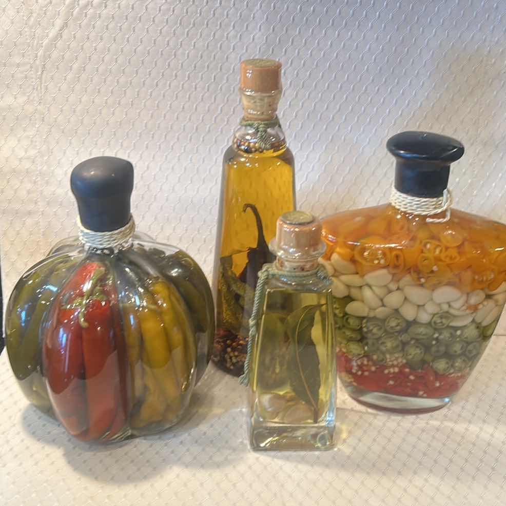 Photo 1 of 4 SEALED OIL AND HERB FILLED GLASS JARS