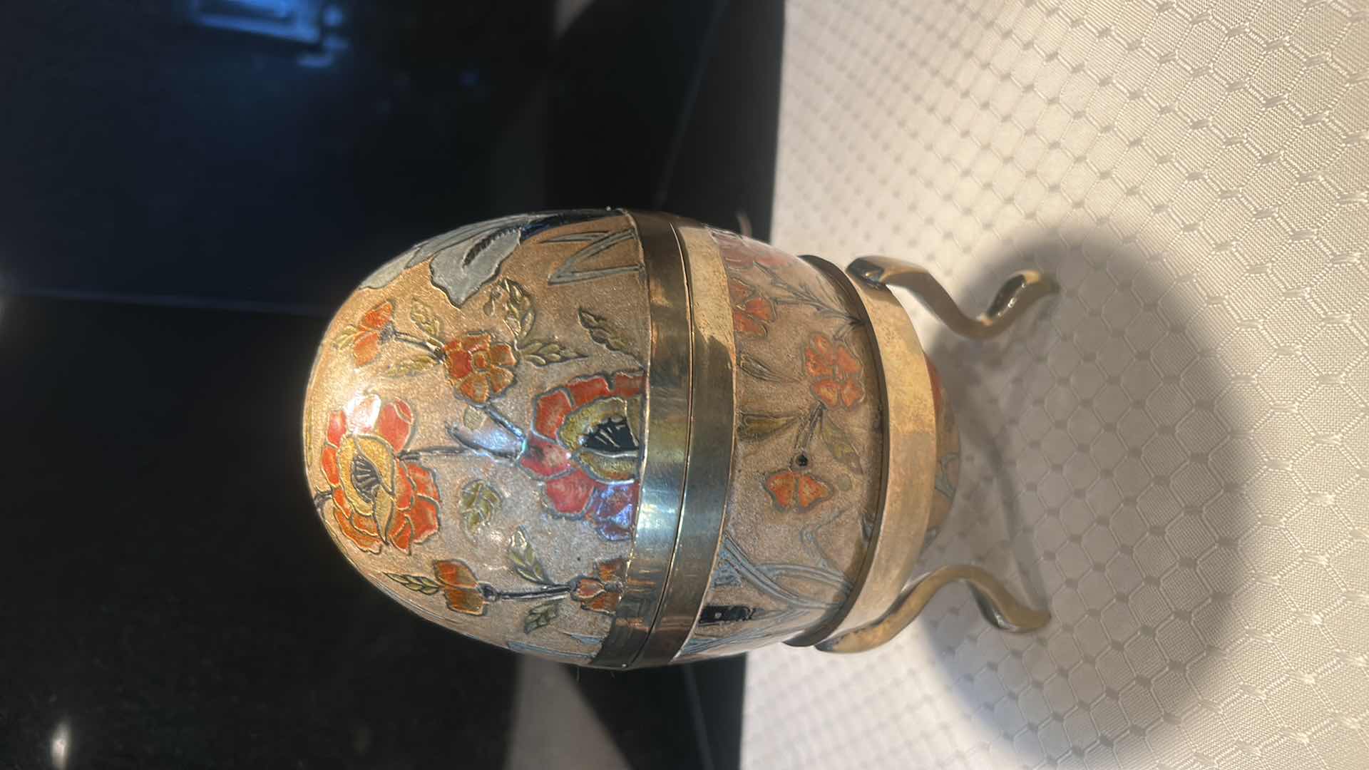 Photo 1 of LARGE HAND PAINTED BRASS EGG WITH BRASS STAND 7 1/4"