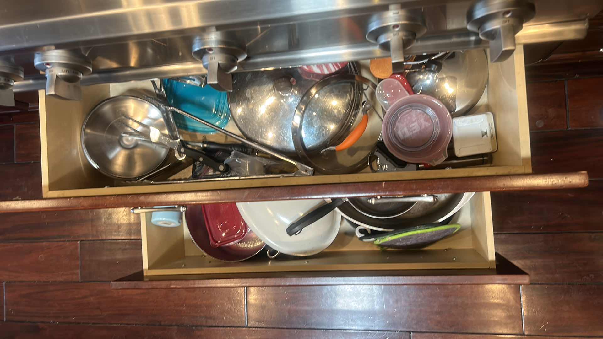 Photo 1 of CONTENTS OF 2 PULL OUT DRAWERS IN KITCHEN- POTS AND PANS