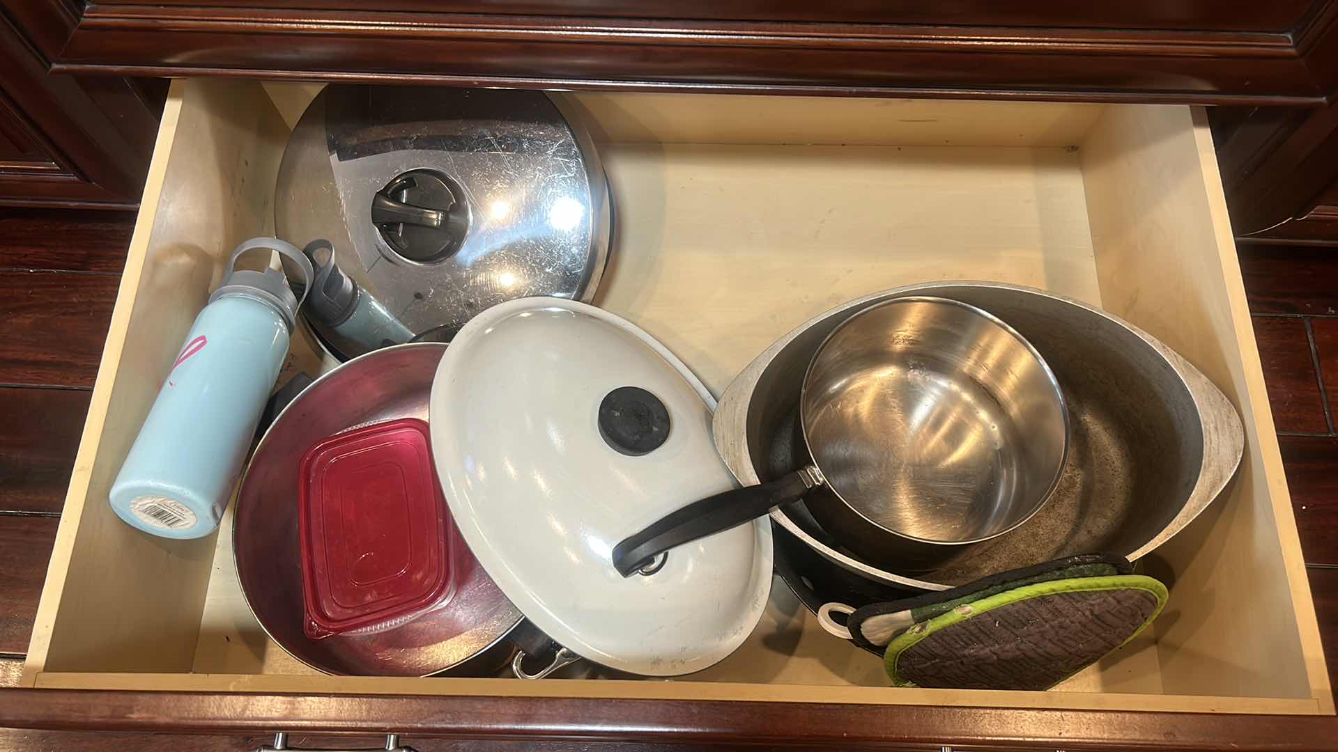 Photo 1 of CONTENTS OF 2 PULL OUT DRAWERS IN KITCHEN- POTS AND PANS