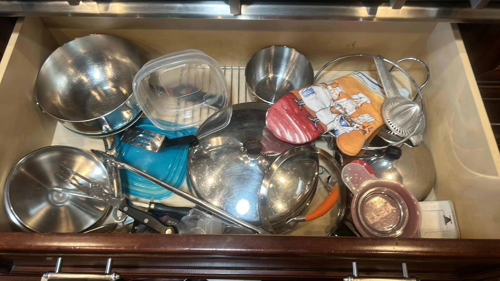 Photo 1 of CONTENTS OF 2 PULL OUT DRAWERS IN KITCHEN- POTS AND PANS