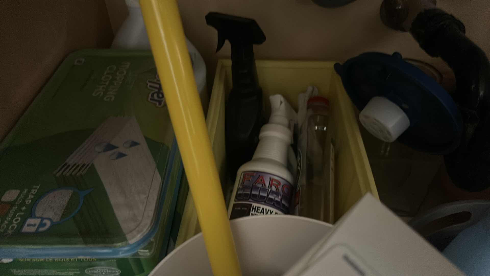 Photo 1 of CLEANING SUPPLIES UNDER SINK IN LAUNDRY ROOM